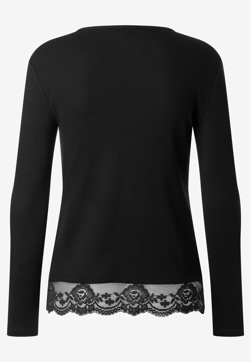 MORE & MORE Rippstrick-Shirt in Schwarz mit zarter Spitzenverzierung am Saum, Rückenansicht. MORE & MORE Rippstrick-Shirt in Schwarz mit zarter Spitzenverzierung am Saum, Rückenansicht.