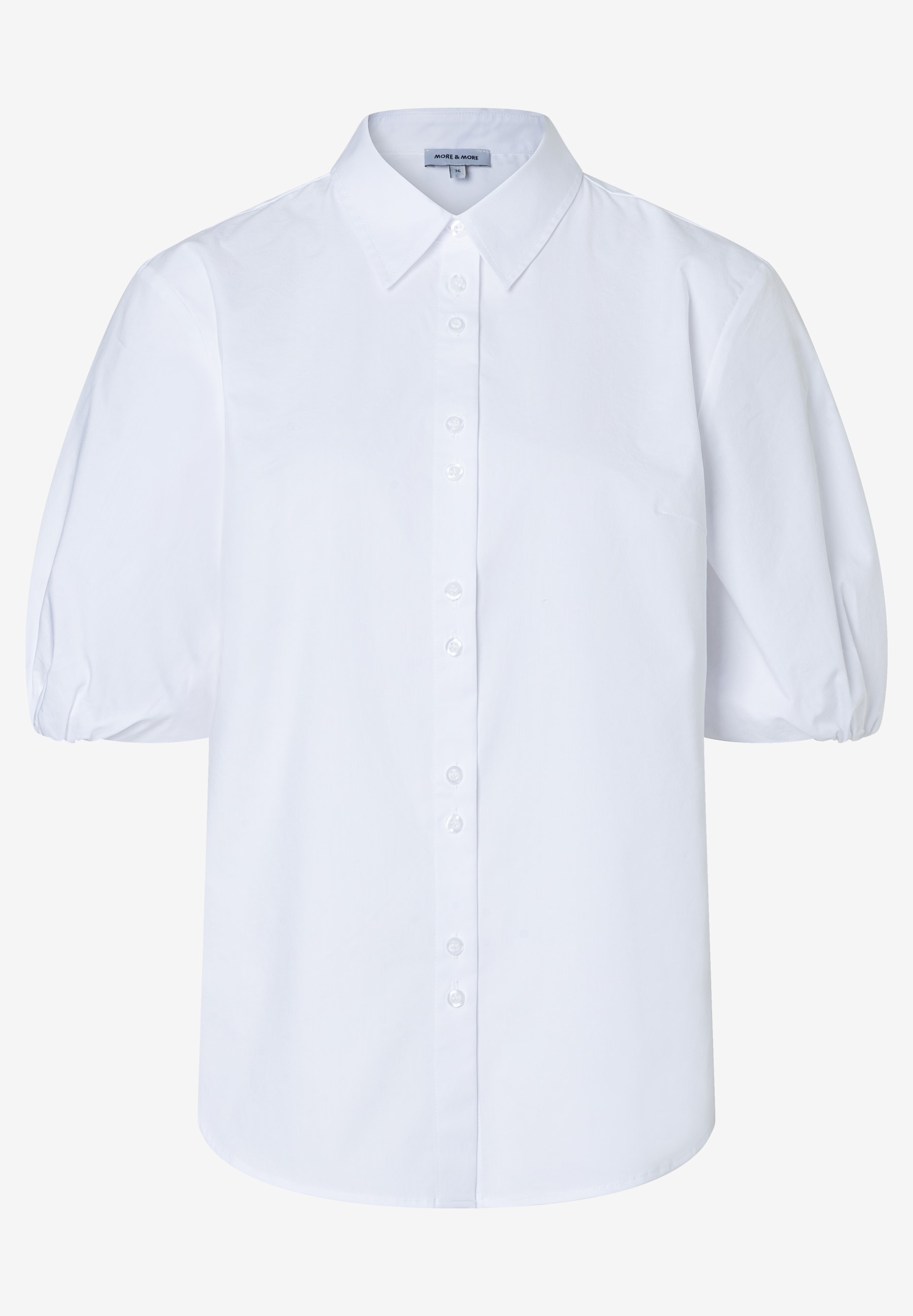 Eine weiße MORE & MORE Bluse mit Puffärmeln und Knopfleiste. Eine weiße MORE & MORE Bluse mit Puffärmeln und Knopfleiste.
