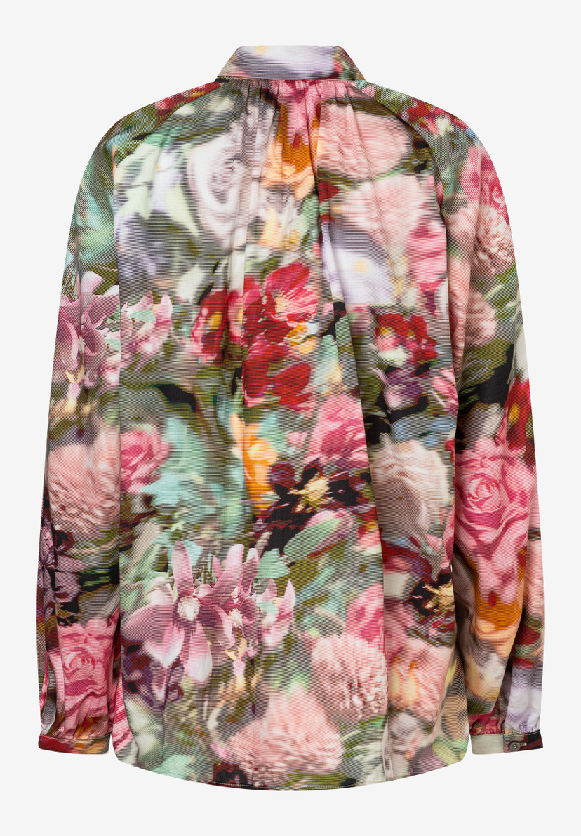 Eine MORE & MORE Bluse mit auffälligem Blumenmuster. Eine MORE & MORE Bluse mit auffälligem Blumenmuster.