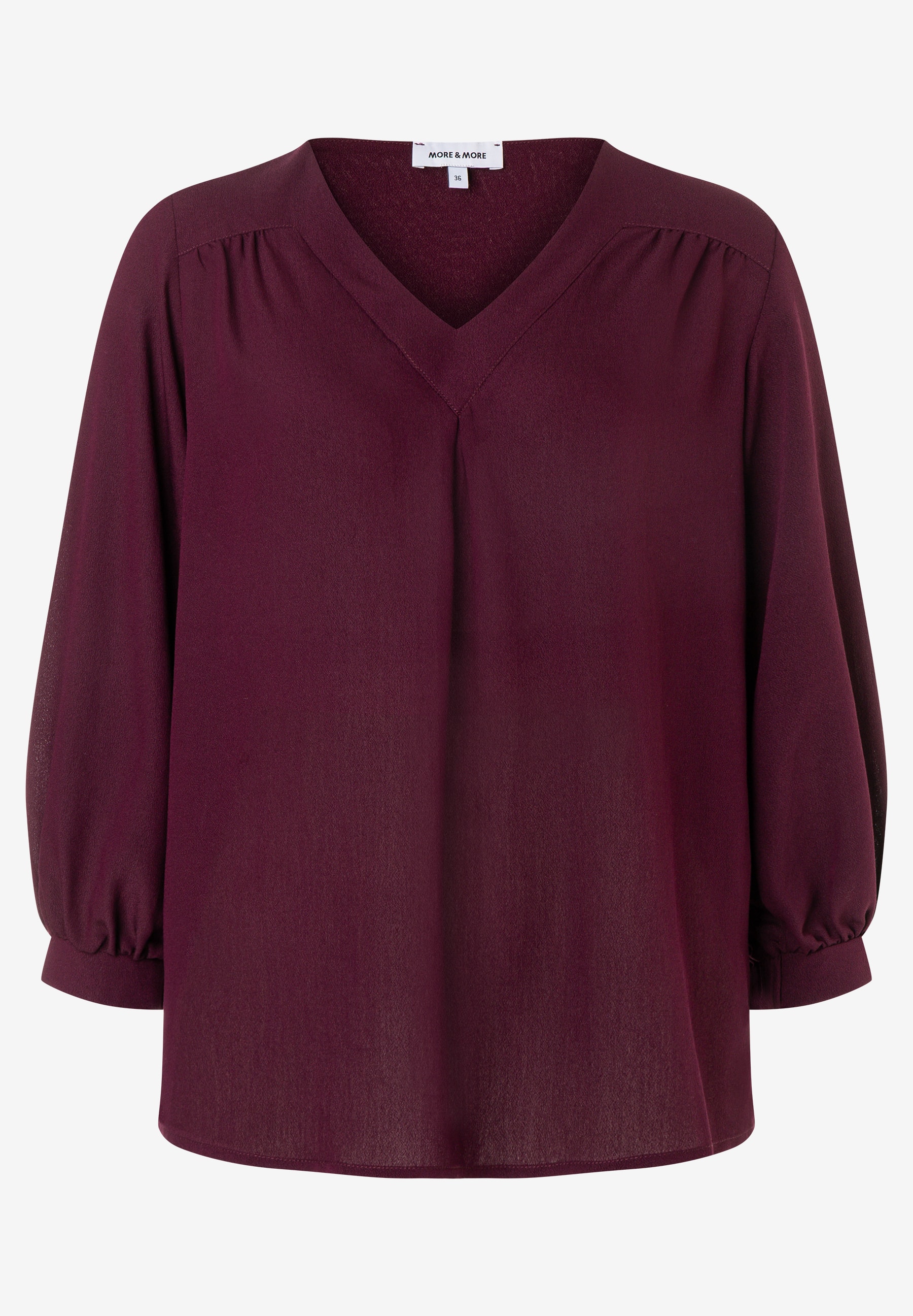MORE & MORE Bluse: Bordeauxrotes Oberteil mit V-Ausschnitt, 3/4-Ärmeln und feinen Falten an den Schultern. MORE & MORE Bluse: Bordeauxrotes Oberteil mit V-Ausschnitt, 3/4-Ärmeln und feinen Falten an den Schultern.