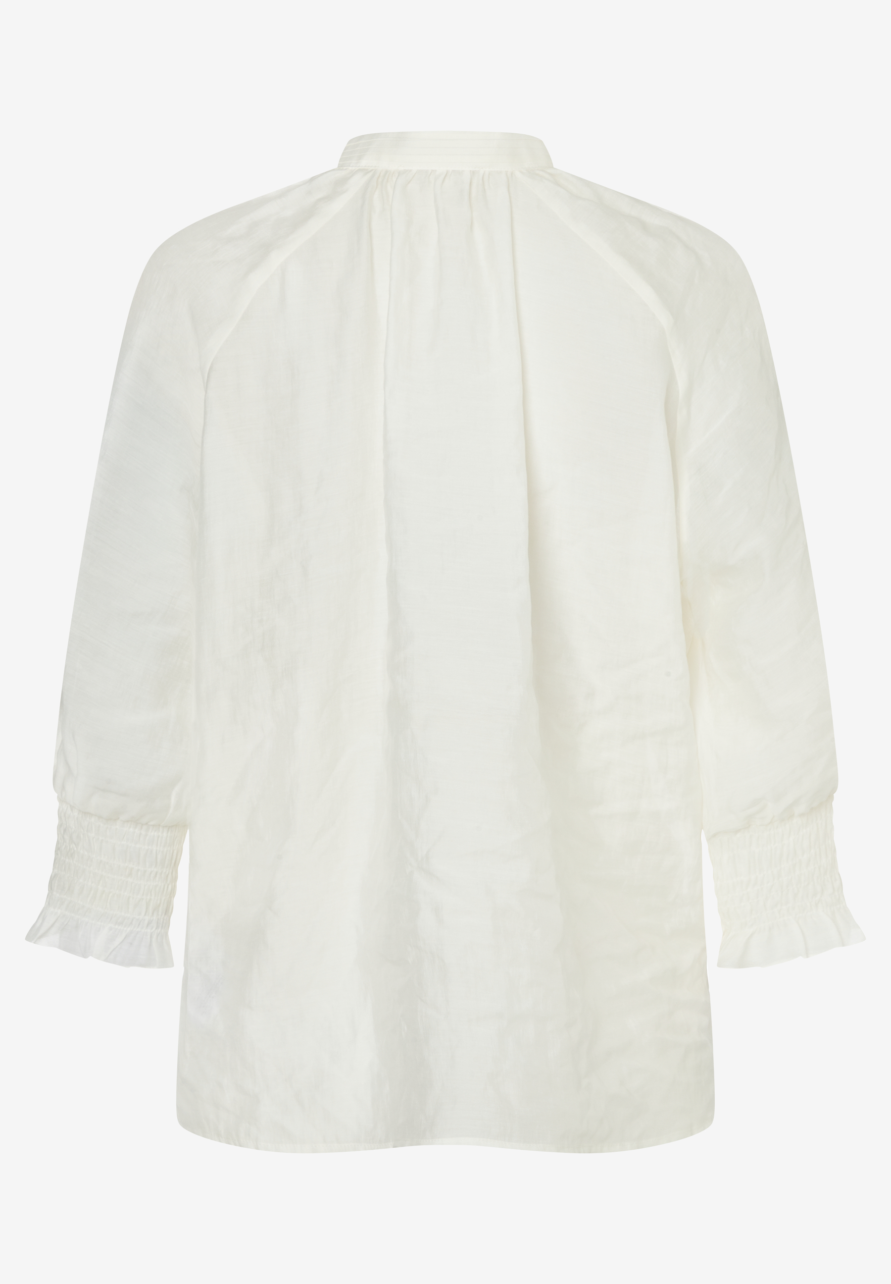 Eine MORE & MORE Bluse in Weiß mit langen Ärmeln und Rüschen an den Bündchen. Eine MORE & MORE Bluse in Weiß mit langen Ärmeln und Rüschen an den Bündchen.