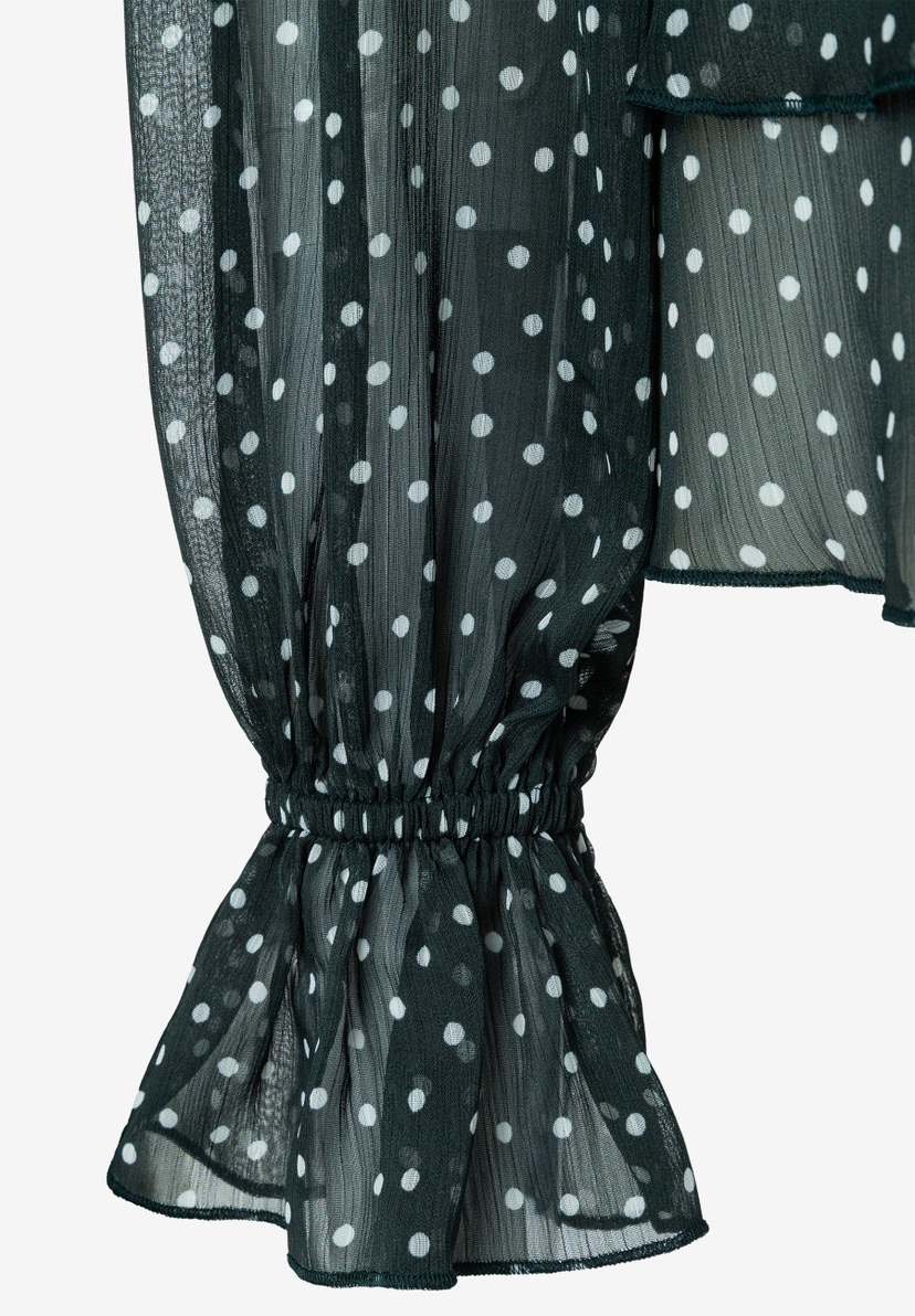 MORE & MORE Bluse: Eine dunkelgrüne Chiffonbluse mit weißen Polka-Dots und Rüschen an den Ärmelbündchen.