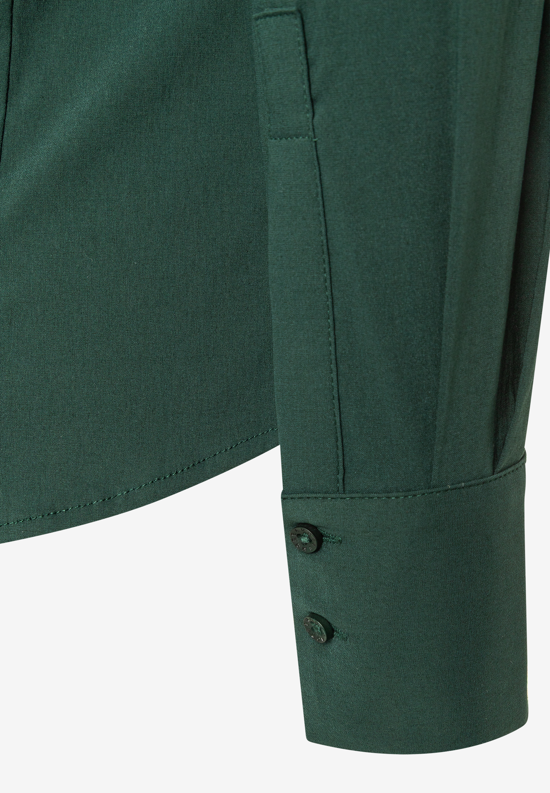 Dunkelgrüne MORE & MORE Bluse aus weichem Stoff mit langen Ärmeln, Bündchen und zwei kleinen Knöpfen am rechten Ärmel. Dunkelgrüne MORE & MORE Bluse aus weichem Stoff mit langen Ärmeln, Bündchen und zwei kleinen Knöpfen am rechten Ärmel.