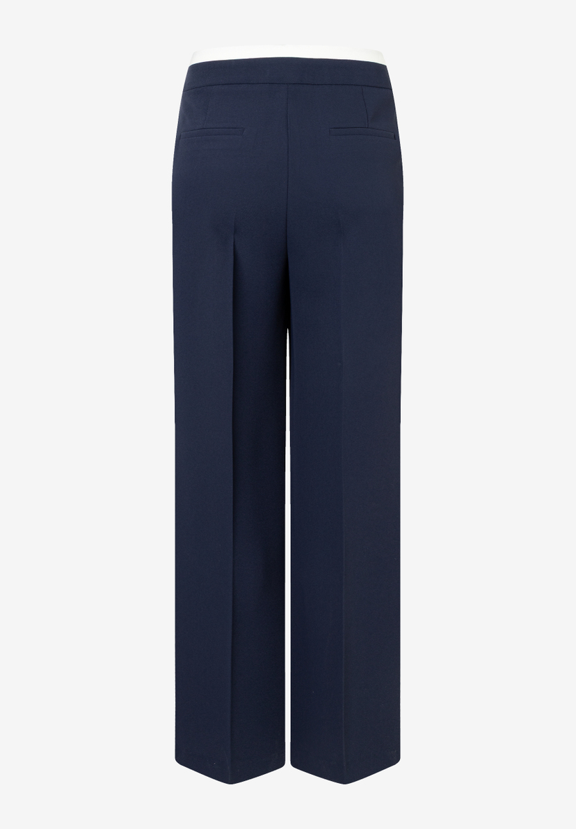 Eine marineblaue MORE & MORE Hose, weites Bein, von hinten. Eine marineblaue MORE & MORE Hose, weites Bein, von hinten.
