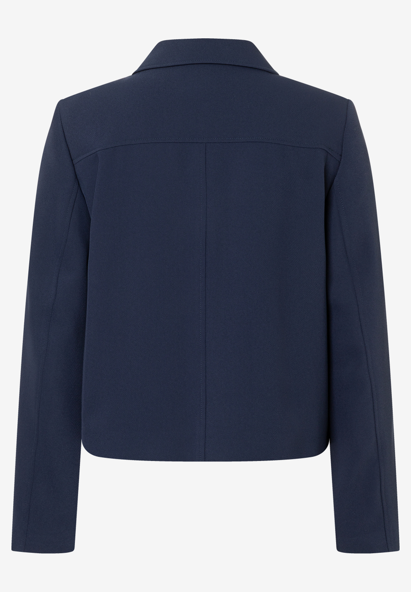 Die Rückansicht eines blauen MORE & MORE Blazers zeigt schlichte Eleganz. Die Rückansicht eines blauen MORE & MORE Blazers zeigt schlichte Eleganz.