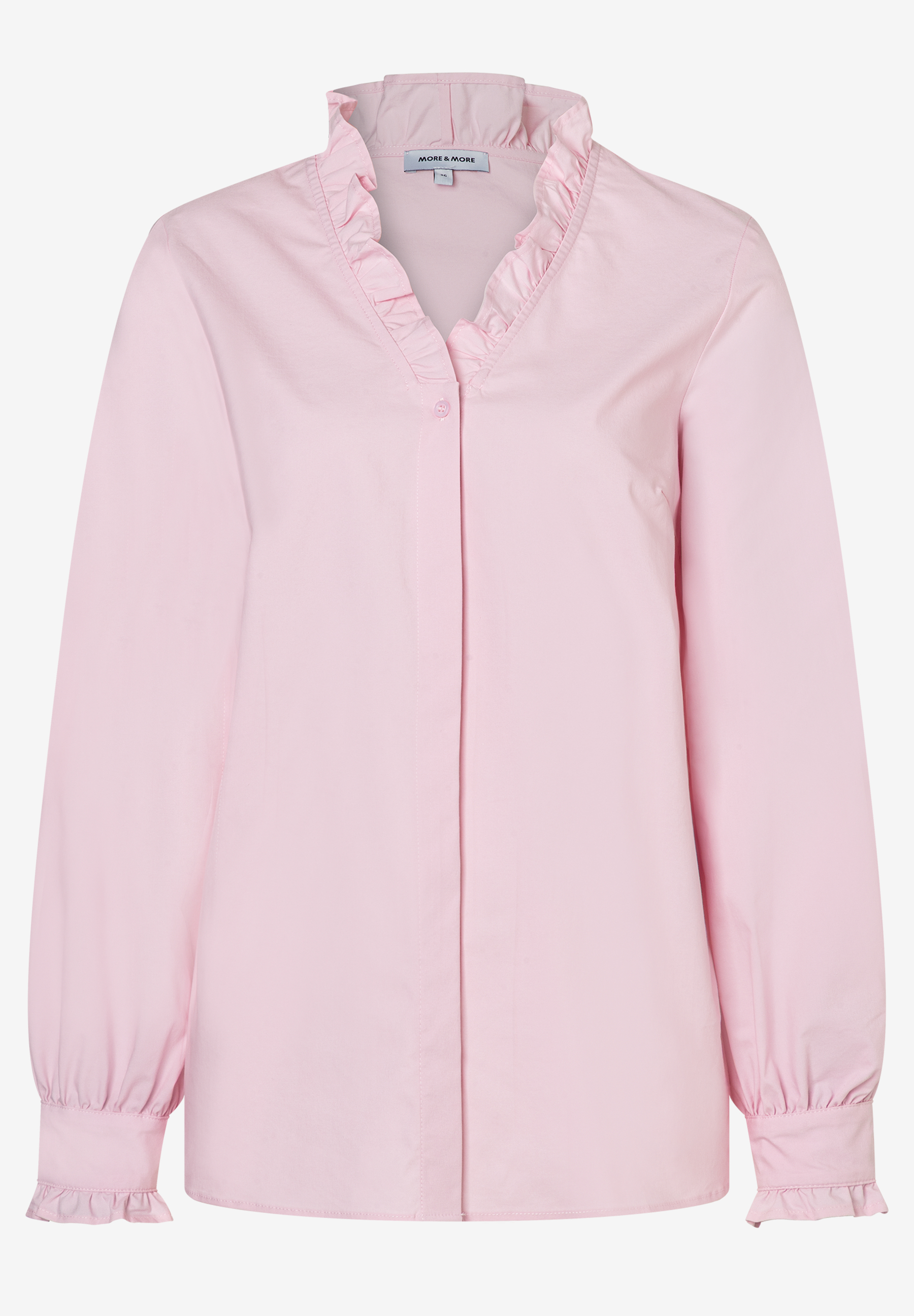 Eine rosafarbene MORE & MORE Bluse mit Rüschen am Kragen und Ärmeln. Eine rosafarbene MORE & MORE Bluse mit Rüschen am Kragen und Ärmeln.