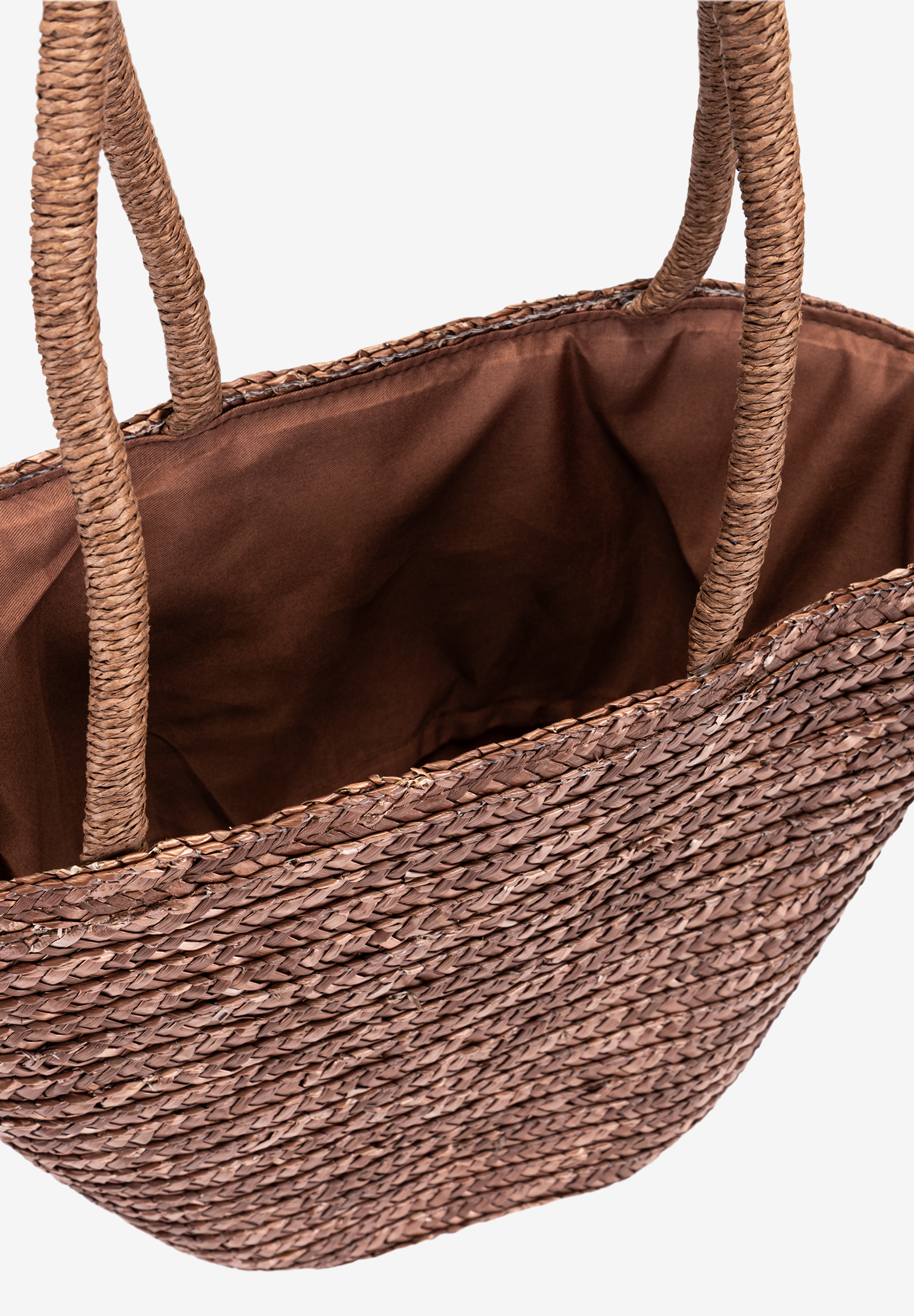 MORE & MORE Henkeltasche aus geflochtenem Bast, oben offen mit braunem Stofffutter. Sichtbar sind die geflochtenen Henkel. MORE & MORE Henkeltasche aus geflochtenem Bast, oben offen mit braunem Stofffutter. Sichtbar sind die geflochtenen Henkel.