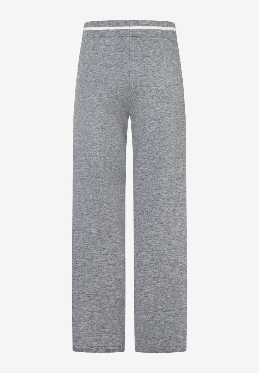Eine graue, lange MORE & MORE Hose mit geradem Bein und weißem Bund, Feinstrick. Eine graue, lange MORE & MORE Hose mit geradem Bein und weißem Bund, Feinstrick.