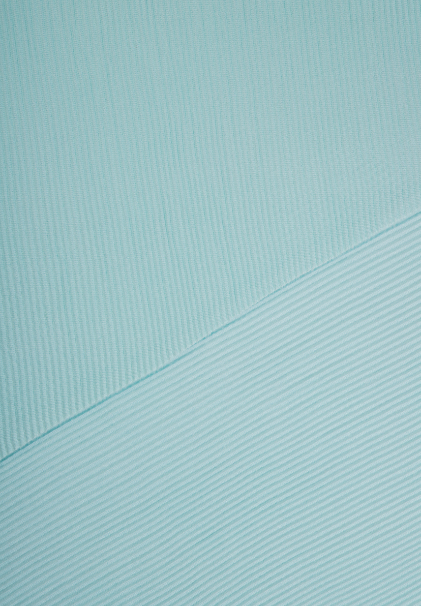 Nahaufnahme eines helltürkisen MORE & MORE Accessoires mit feiner, gerippter Struktur. Nahaufnahme eines helltürkisen MORE & MORE Accessoires mit feiner, gerippter Struktur.