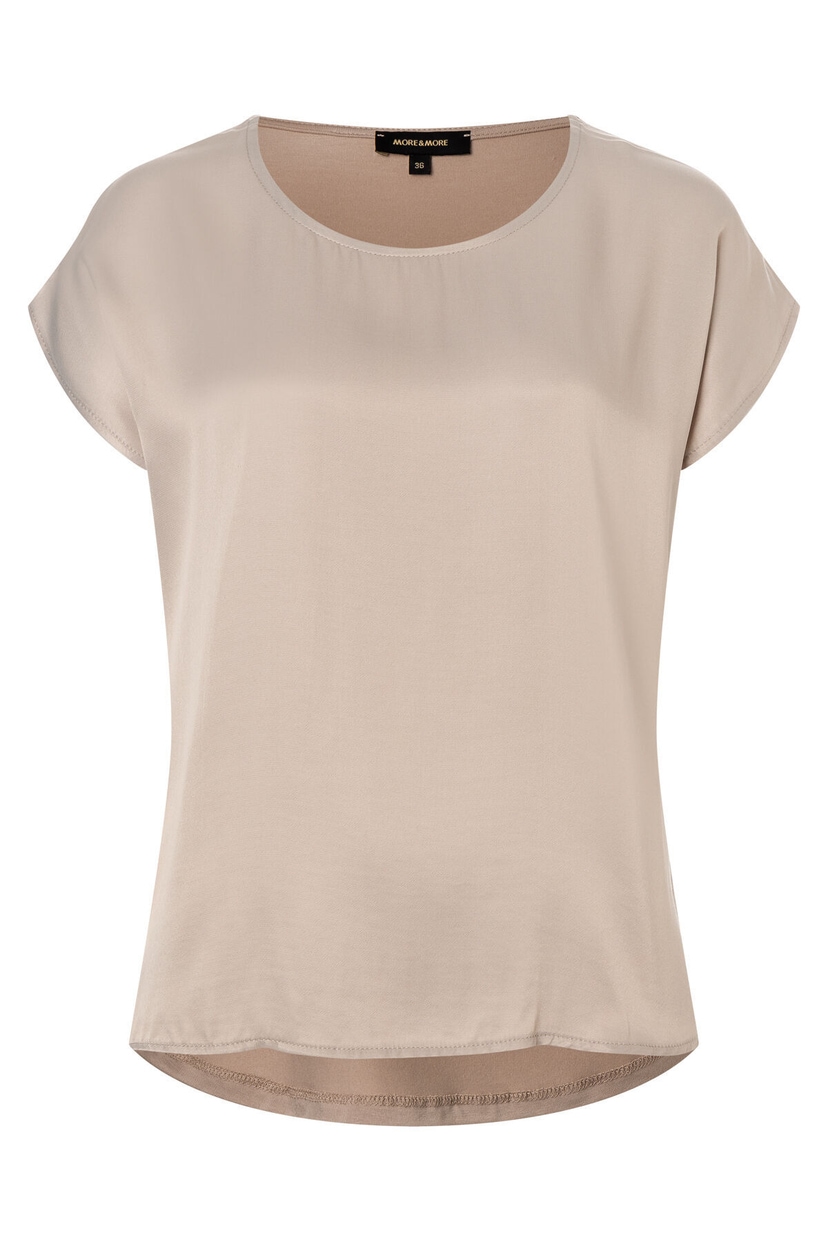 Ein MORE & MORE Oberteil mit kurzem Arm in sanftem Beige. Ein MORE & MORE Oberteil mit kurzem Arm in sanftem Beige.
