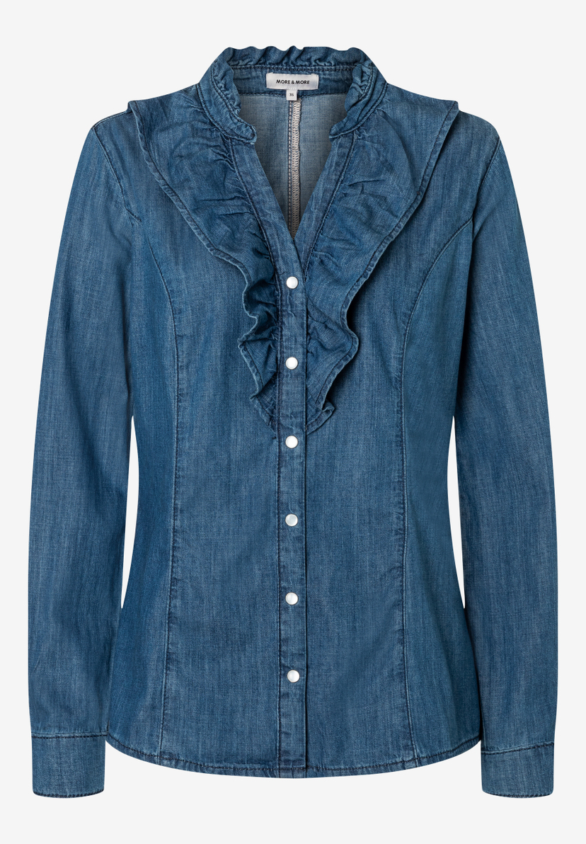 Eine blaue MORE & MORE Bluse mit Rüschen und weißen Knöpfen. Eine blaue MORE & MORE Bluse mit Rüschen und weißen Knöpfen.