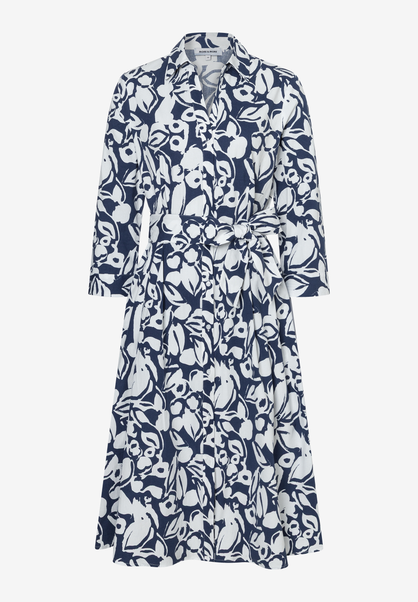 Ein MORE & MORE Oberteil/Kleid mit blau-weißem Blütenmuster und Bindegürtel. Ein MORE & MORE Oberteil/Kleid mit blau-weißem Blütenmuster und Bindegürtel.