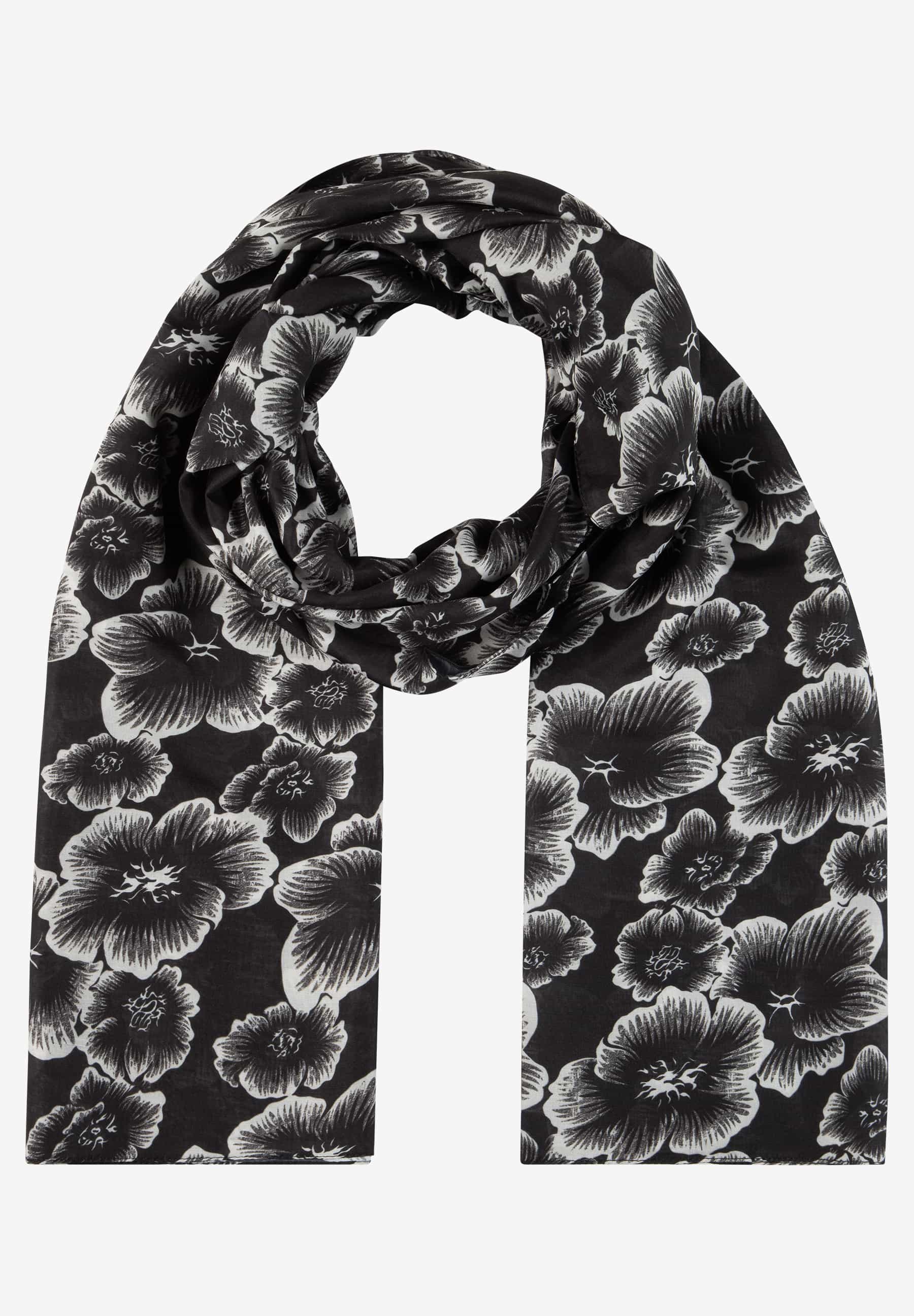 MORE & MORE Accessoire: Schwarz-weißer Schal mit Blumenmuster, elegant um den Hals drapiert vor grauem Hintergrund.