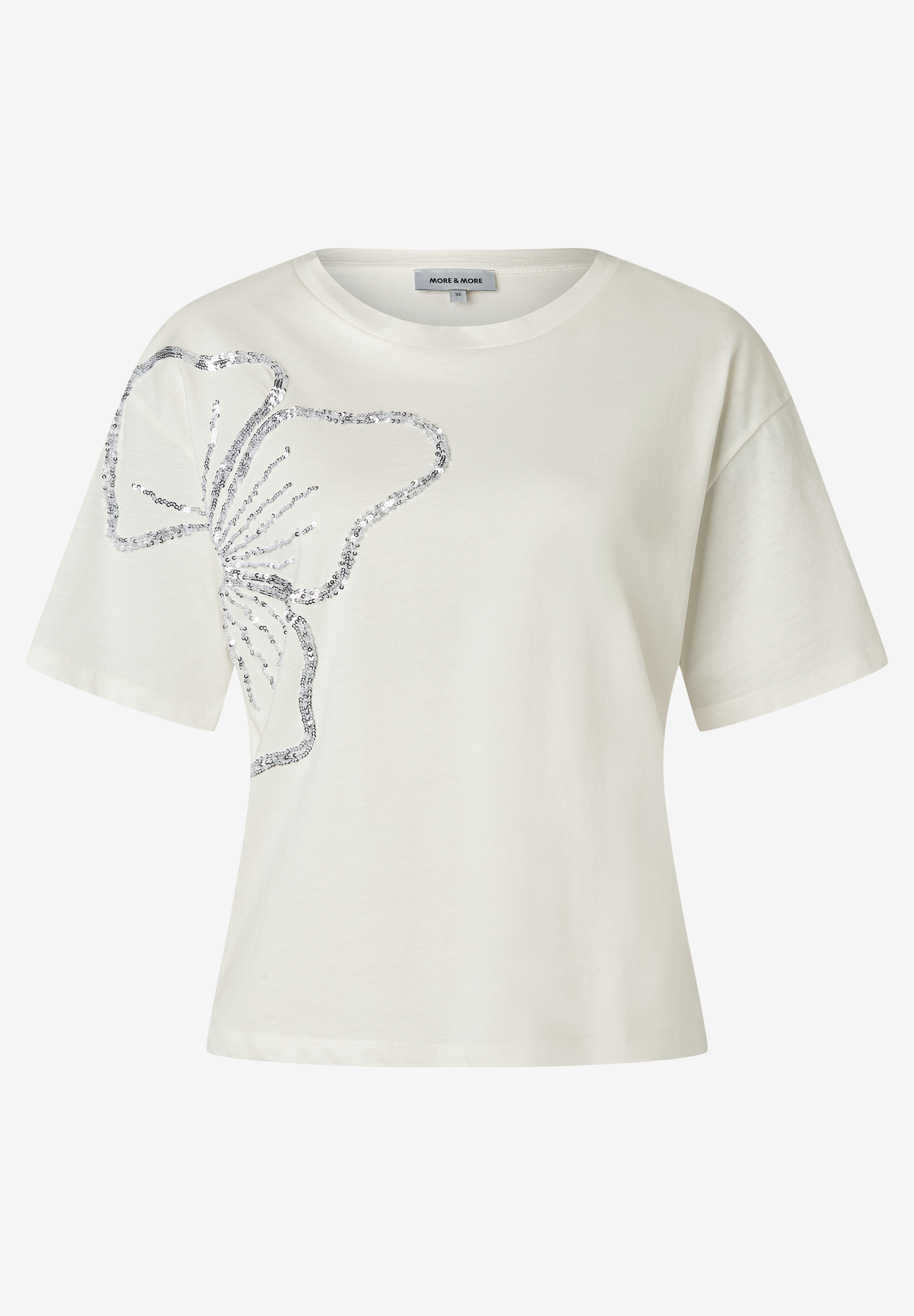 MORE & MORE Damen T-Shirt in hellem Beige, aus elastischem Jersey, mit silbernem Pailletten-Schmetterling auf der linken Brust. MORE & MORE Damen T-Shirt in hellem Beige, aus elastischem Jersey, mit silbernem Pailletten-Schmetterling auf der linken Brust.