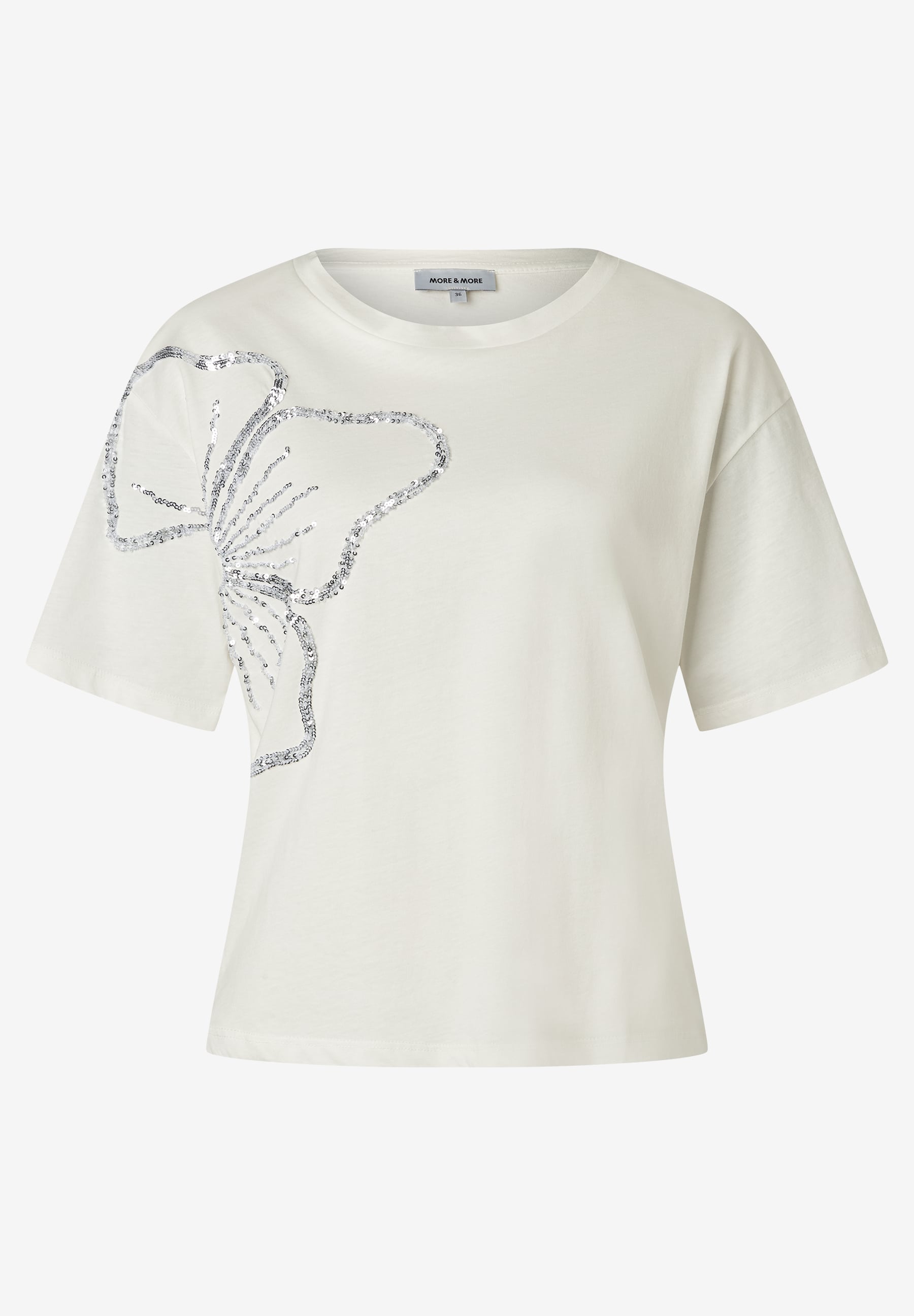 MORE & MORE Damen T-Shirt in hellem Beige, aus elastischem Jersey, mit silbernem Pailletten-Schmetterling auf der linken Brust. MORE & MORE Damen T-Shirt in hellem Beige, aus elastischem Jersey, mit silbernem Pailletten-Schmetterling auf der linken Brust.