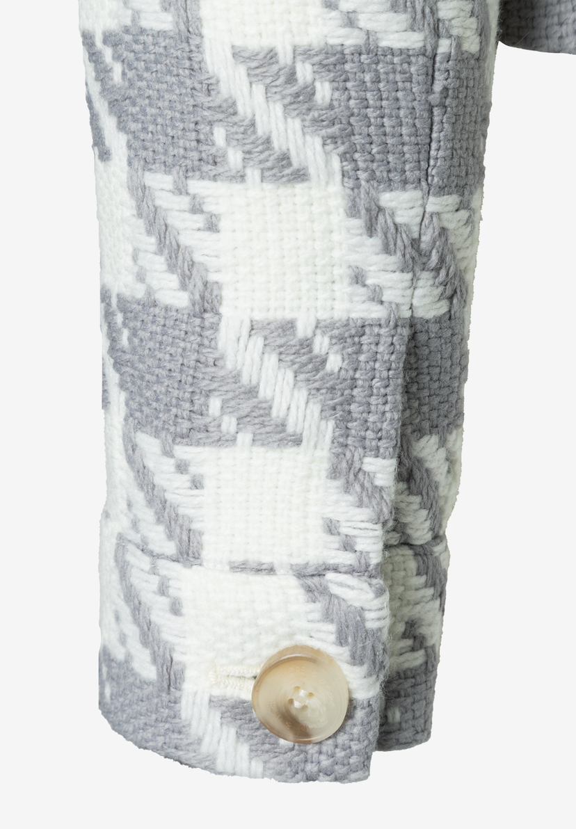 Ärmel einer MORE & MORE Jacke/Blazer mit Hahnentrittmuster und Knopf. Ärmel einer MORE & MORE Jacke/Blazer mit Hahnentrittmuster und Knopf.