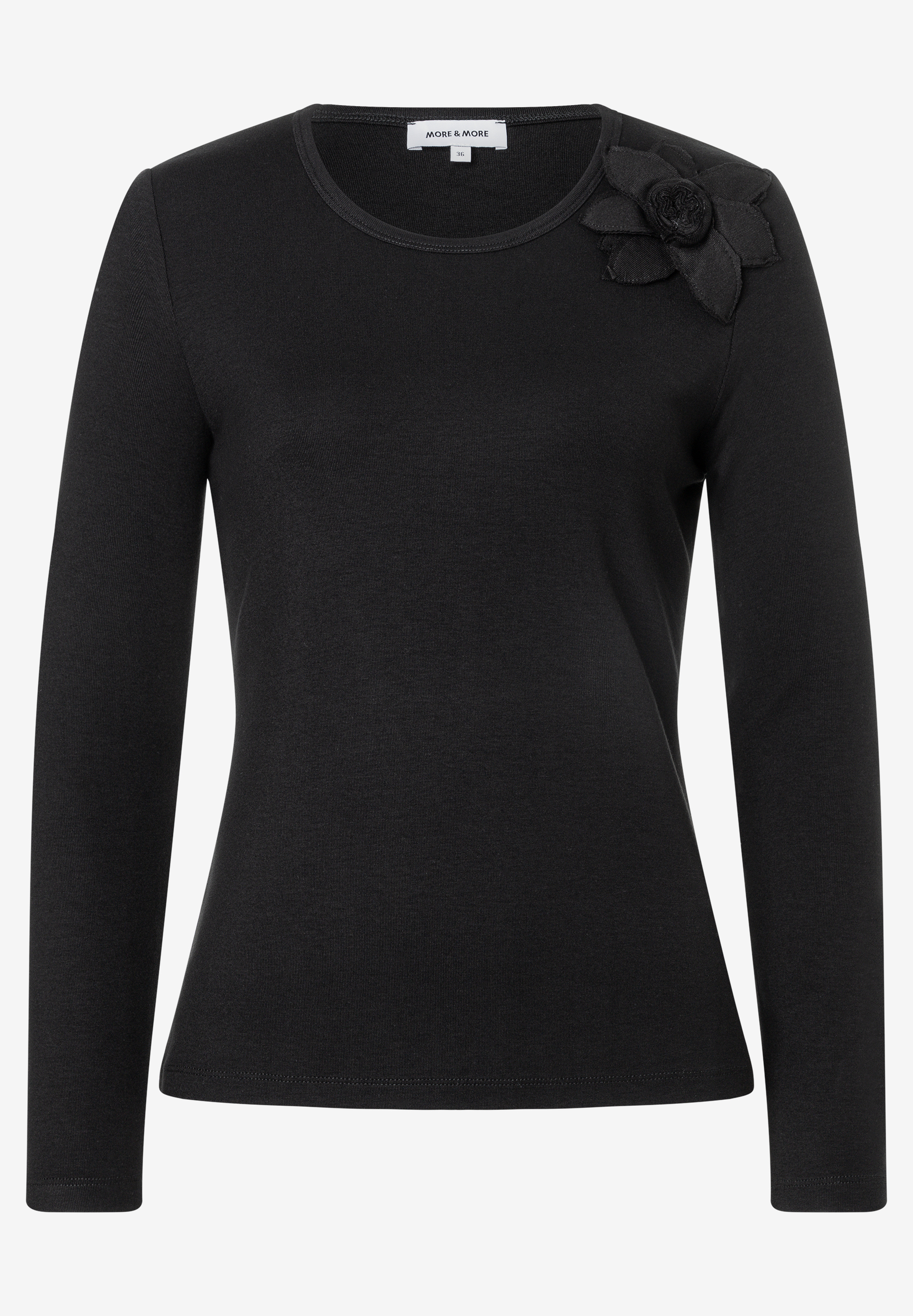 MORE & MORE schwarzes Langarmshirt mit Rundhalsausschnitt und dekorativer Stoffblume auf der rechten Schulter
