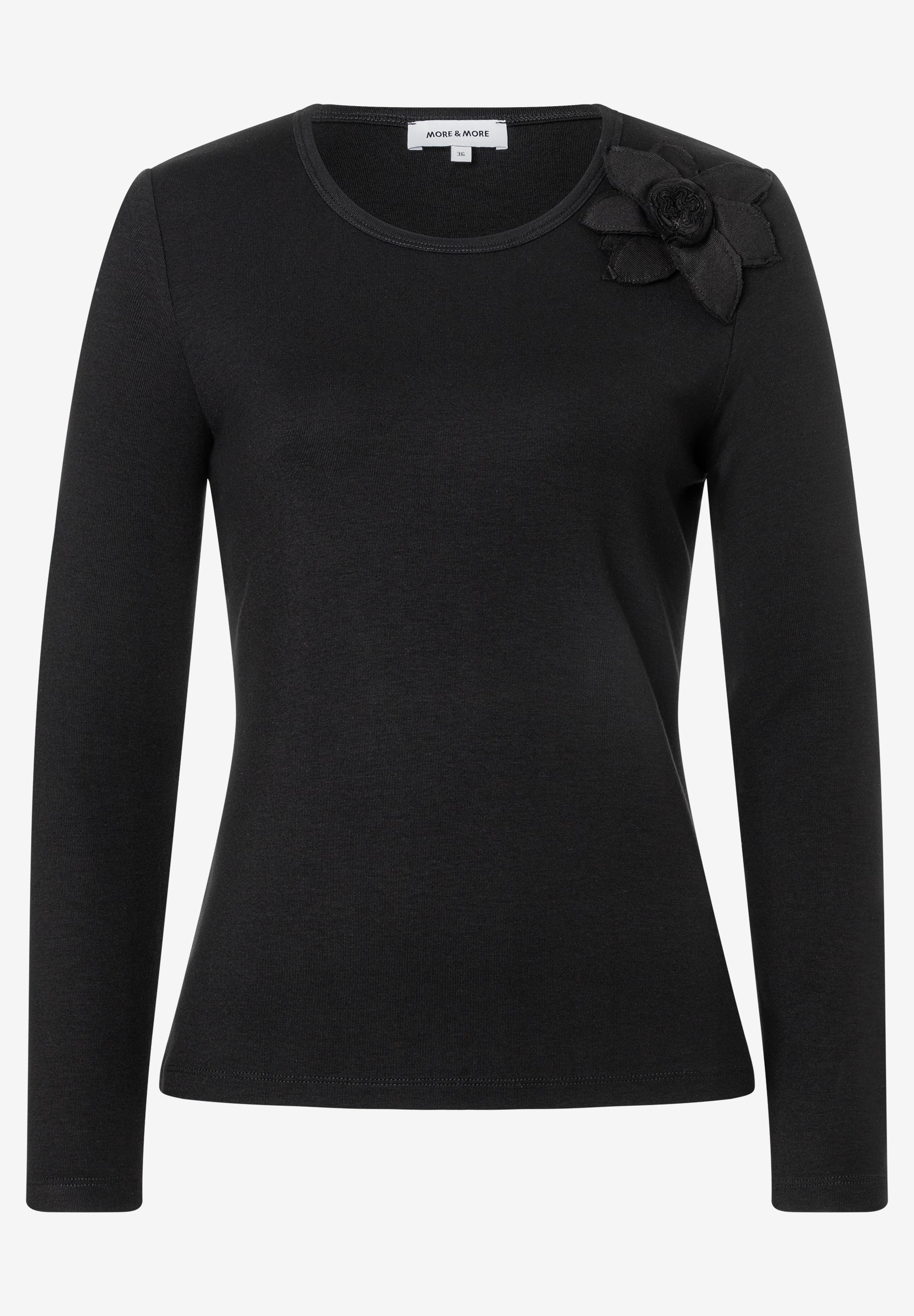 MORE & MORE schwarzes Langarmshirt mit Rundhalsausschnitt und dekorativer Stoffblume auf der rechten Schulter