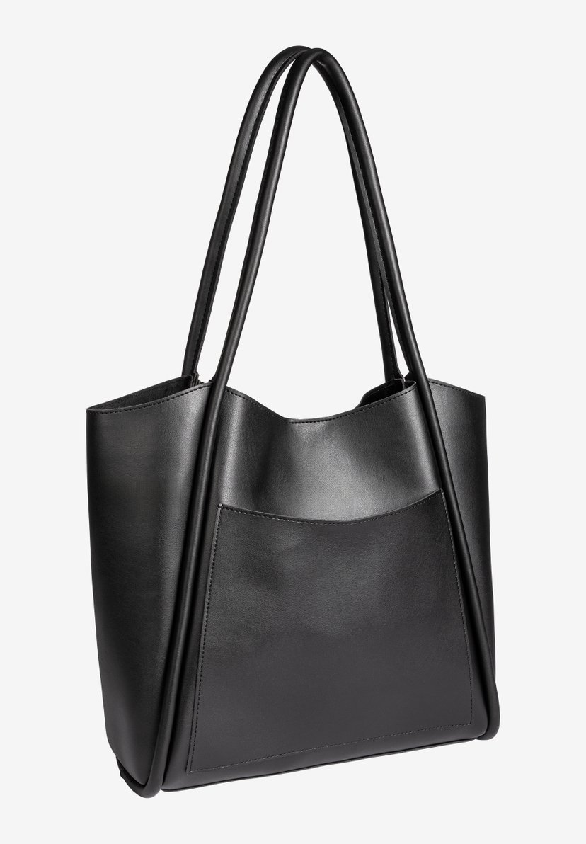 Eine schwarze MORE & MORE Handtasche mit Tragegriffen und Außentasche. Eine schwarze MORE & MORE Handtasche mit Tragegriffen und Außentasche.