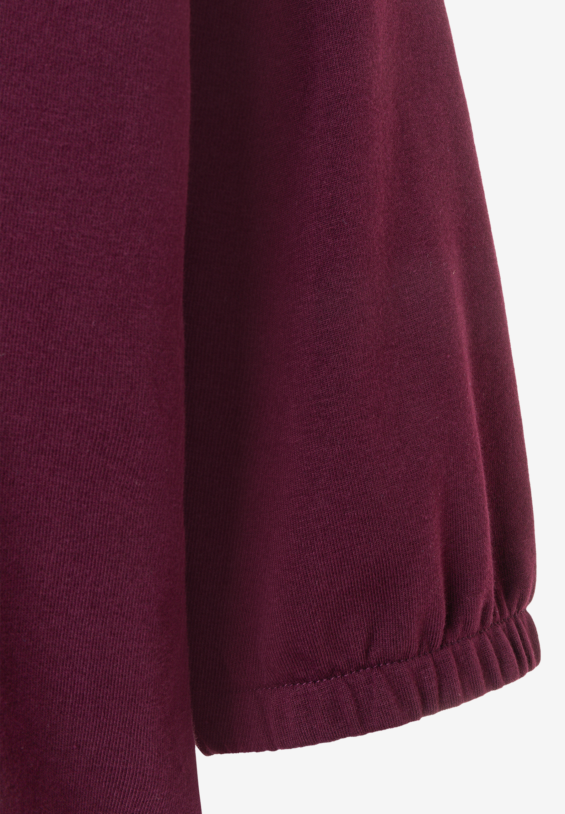 MORE & MORE Sweatshirt: Nahaufnahme des Ärmels eines weinroten MORE & MORE Sweatshirts mit Gummizugbündchen. MORE & MORE Sweatshirt: Nahaufnahme des Ärmels eines weinroten MORE & MORE Sweatshirts mit Gummizugbündchen.