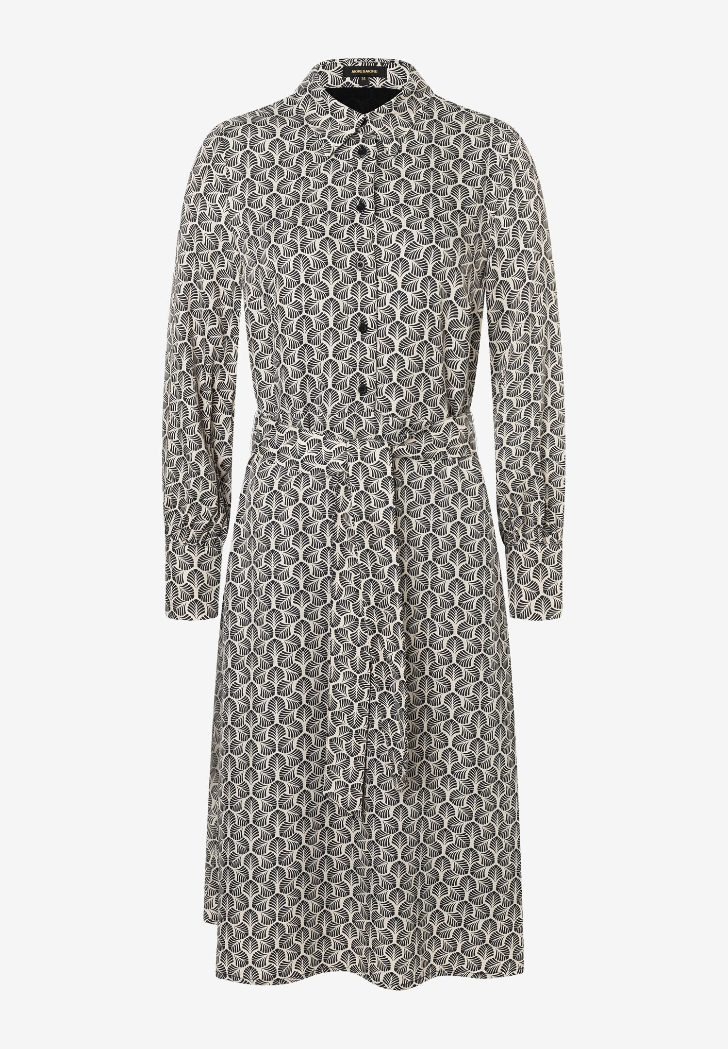 Ein MORE & MORE Oberteil mit Muster und langen Ärmeln. Ein MORE & MORE Oberteil mit Muster und langen Ärmeln.