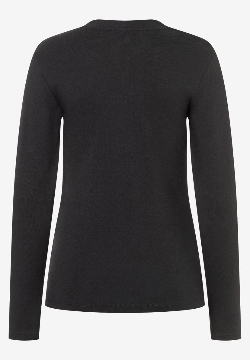 Ein schwarzes MORE & MORE Jersey-Oberteil mit langen Ärmeln. Ein schwarzes MORE & MORE Jersey-Oberteil mit langen Ärmeln.