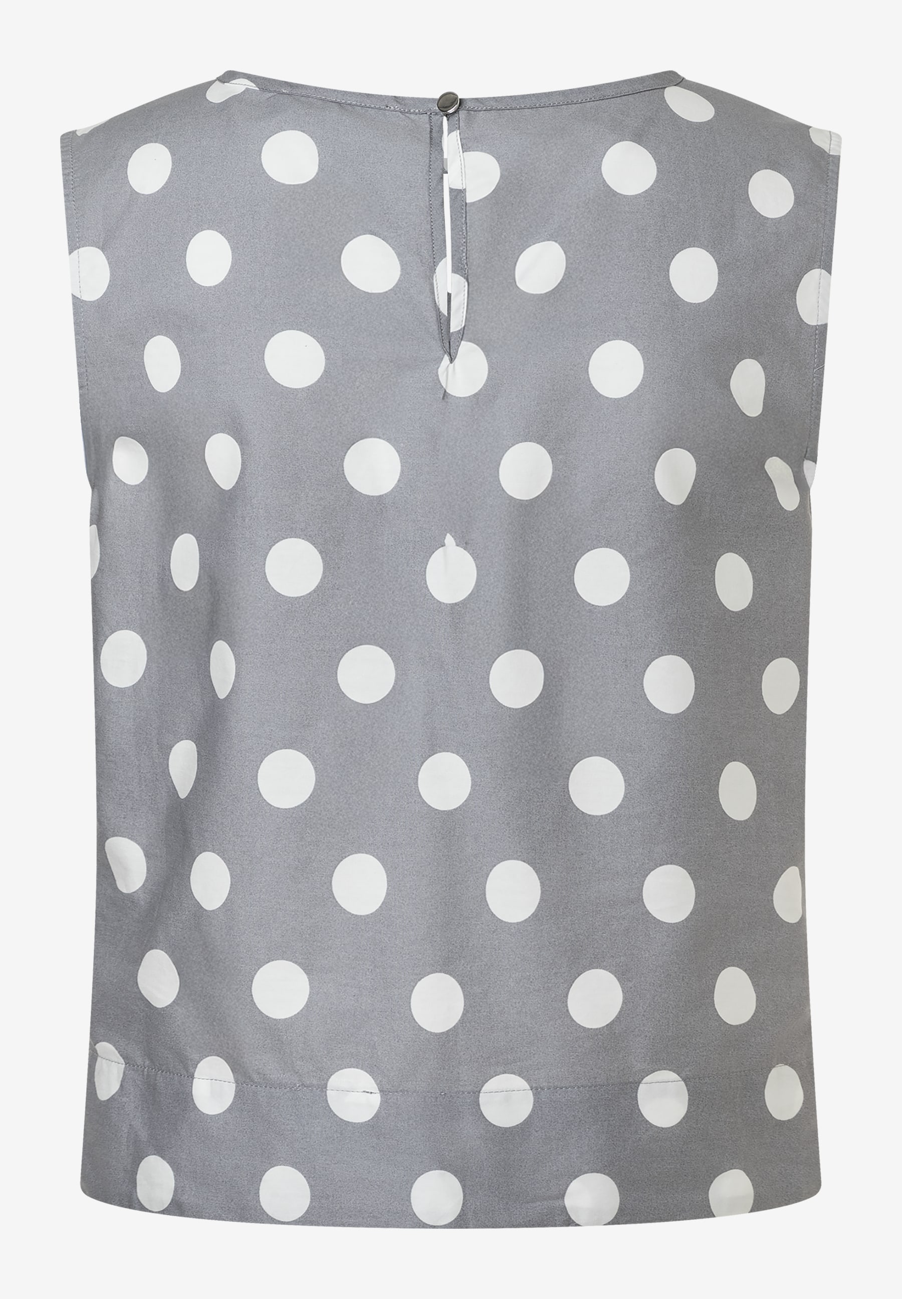 Eine ärmellose MORE & MORE Bluse mit weißen Punkten auf grauem Stoff. Popeline mit Knopf im Nacken. Eine ärmellose MORE & MORE Bluse mit weißen Punkten auf grauem Stoff. Popeline mit Knopf im Nacken.