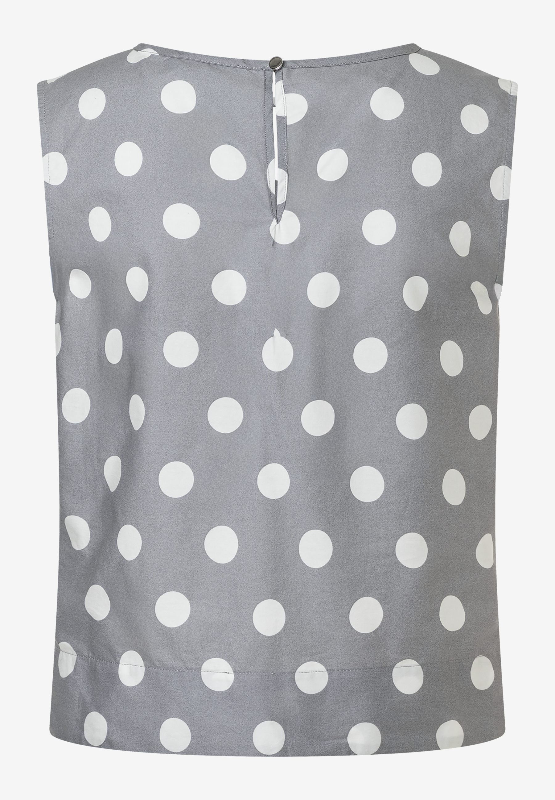 Eine ärmellose MORE & MORE Bluse mit weißen Punkten auf grauem Stoff. Popeline mit Knopf im Nacken. Eine ärmellose MORE & MORE Bluse mit weißen Punkten auf grauem Stoff. Popeline mit Knopf im Nacken.