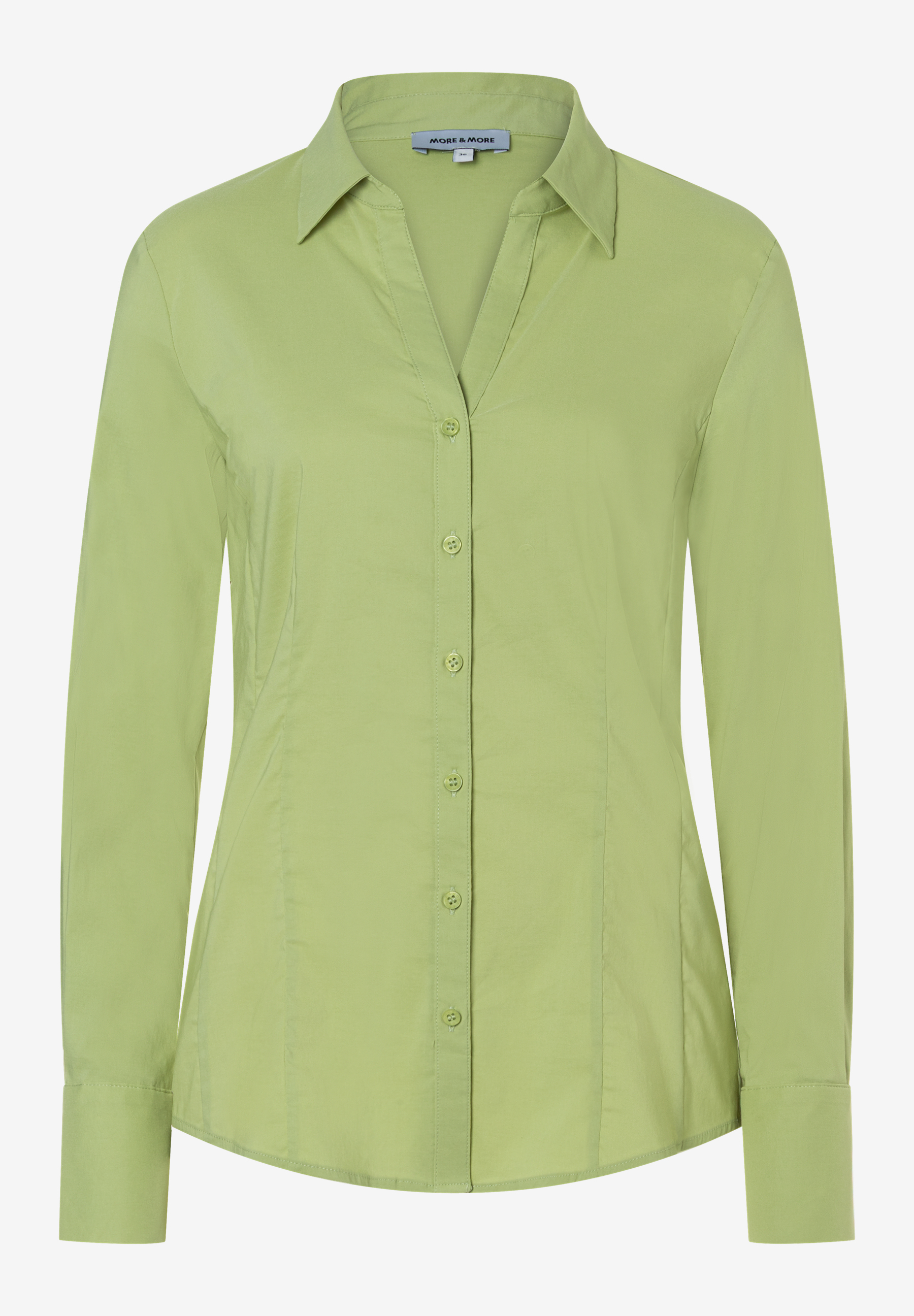 Eine hellgrüne, langärmlige Bluse von MORE & MORE mit Knopfleiste und Kragen. Eine hellgrüne, langärmlige Bluse von MORE & MORE mit Knopfleiste und Kragen.