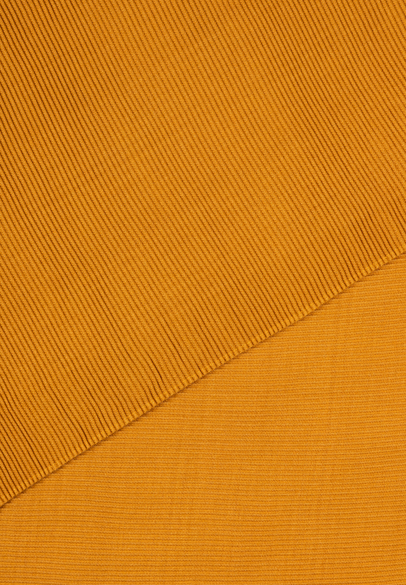 Nahaufnahme des MORE & MORE Accessoires in Senfgelb mit Rippmuster diagonal und horizontal. Nahaufnahme des MORE & MORE Accessoires in Senfgelb mit Rippmuster diagonal und horizontal.