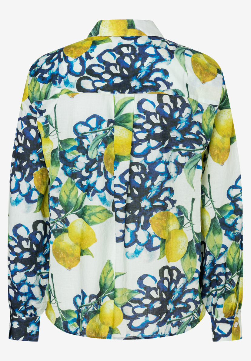 Eine MORE & MORE Bluse mit Zitrone- und Blumenmuster. Eine MORE & MORE Bluse mit Zitrone- und Blumenmuster.