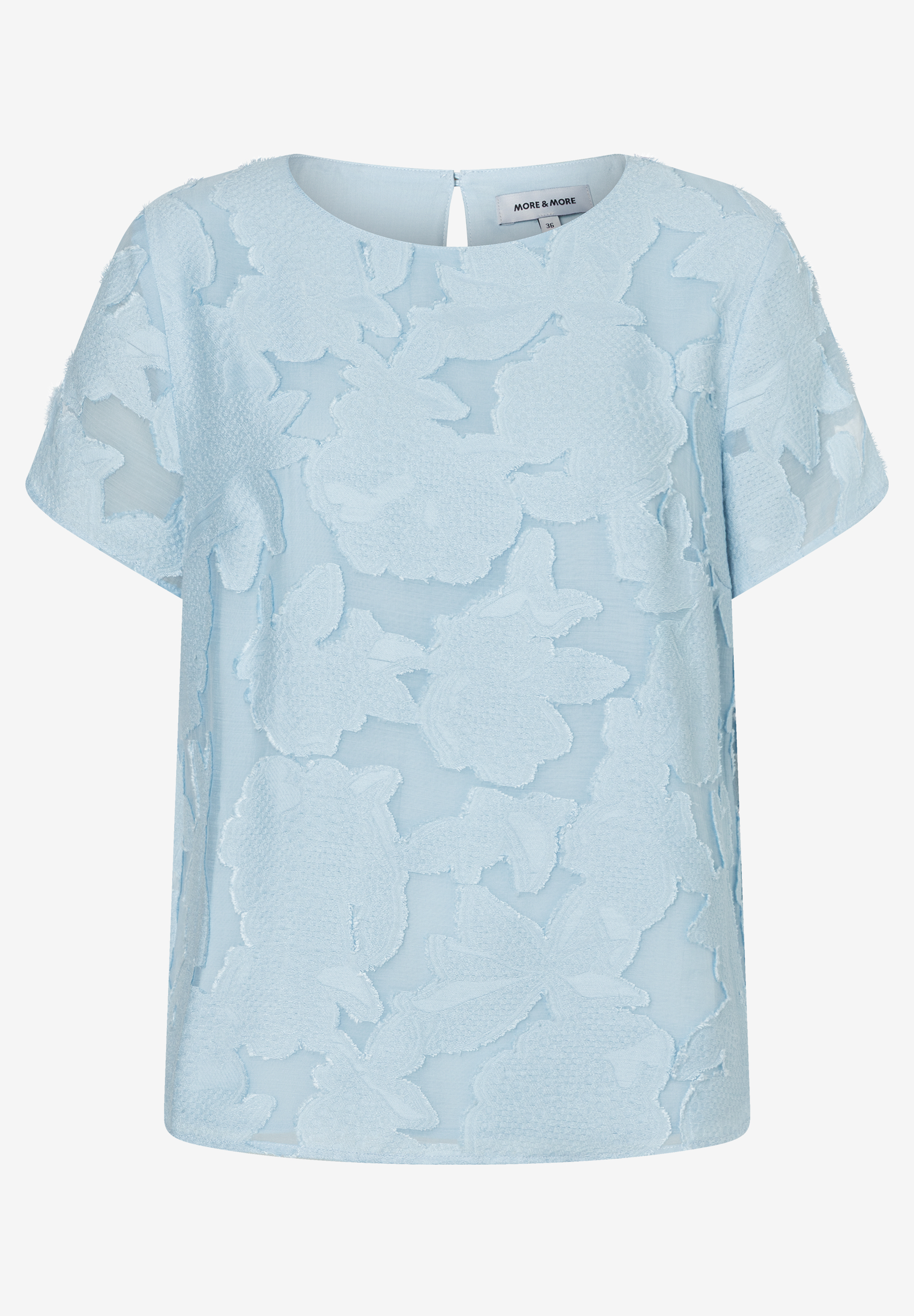 Hellblaue MORE & MORE Bluse mit floralem Muster und kurzen Ärmeln. Hellblaue MORE & MORE Bluse mit floralem Muster und kurzen Ärmeln.