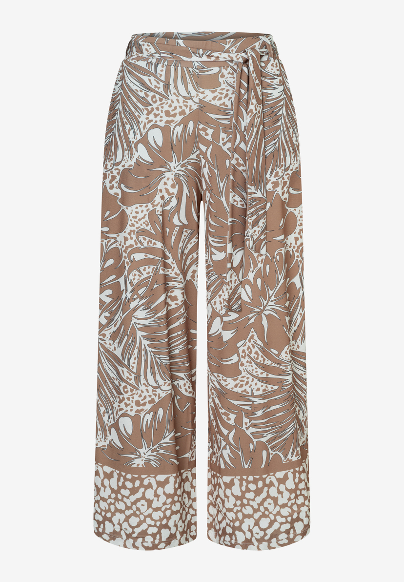 Eine MORE & MORE Hose mit braun-weißem Blätter- und Punktmuster. Jersey-Material sorgt für angenehmen Tragekomfort.