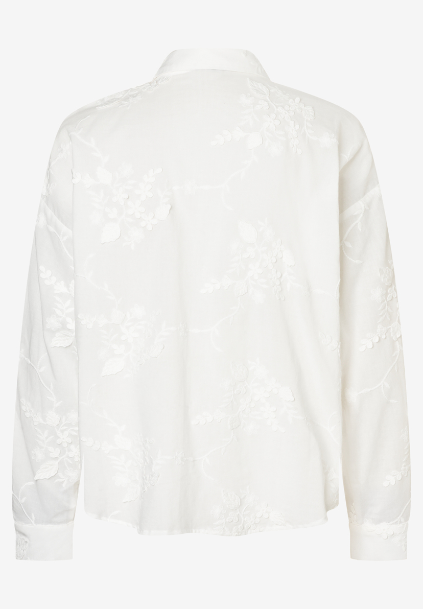 Die weiße MORE & MORE Bluse hat ein florales Muster. Die weiße MORE & MORE Bluse hat ein florales Muster.