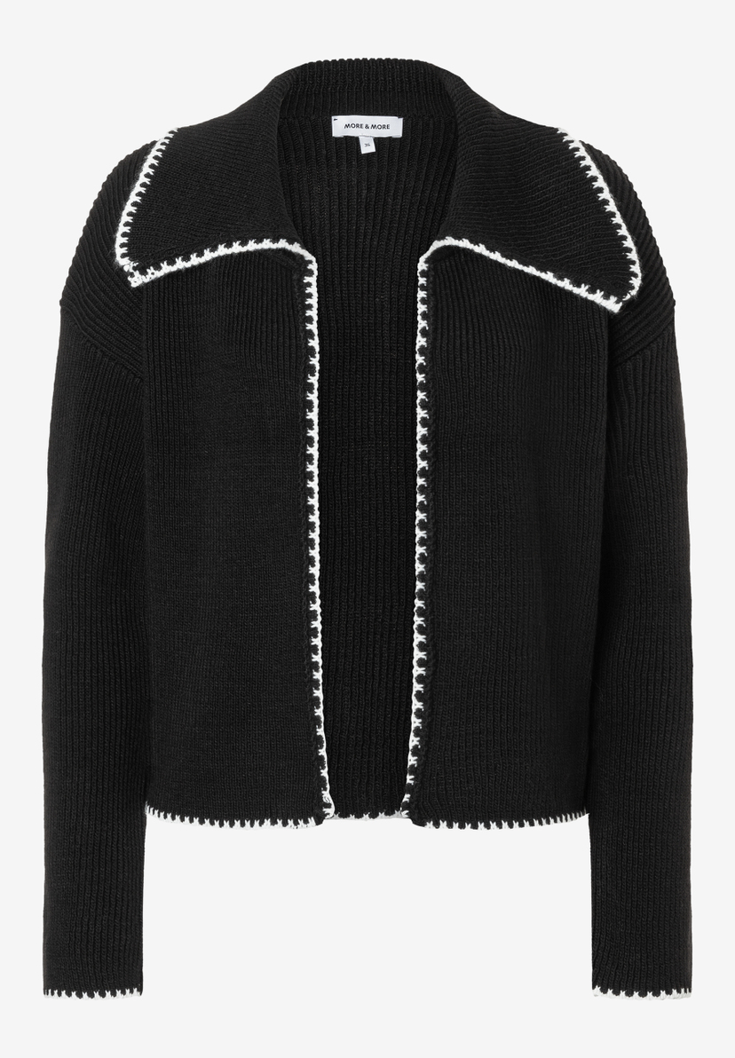 Ein schwarzer Strick-Cardigan von MORE & MORE mit weißem Saum. Ein schwarzer Strick-Cardigan von MORE & MORE mit weißem Saum.