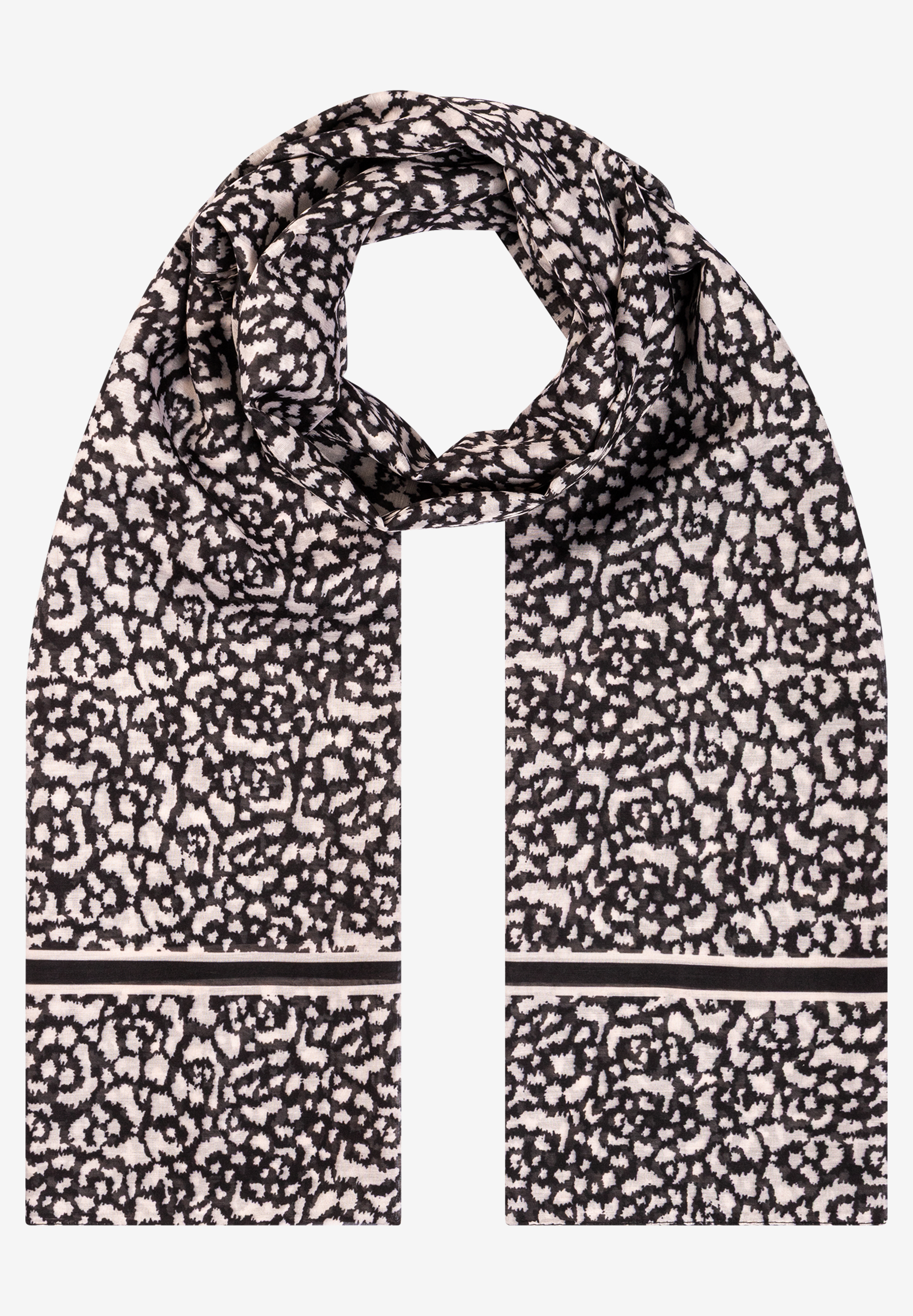 Ein MORE & MORE Accessoire: Ein schwarz-weißer Schal mit abstraktem Muster. Ein MORE & MORE Accessoire: Ein schwarz-weißer Schal mit abstraktem Muster.