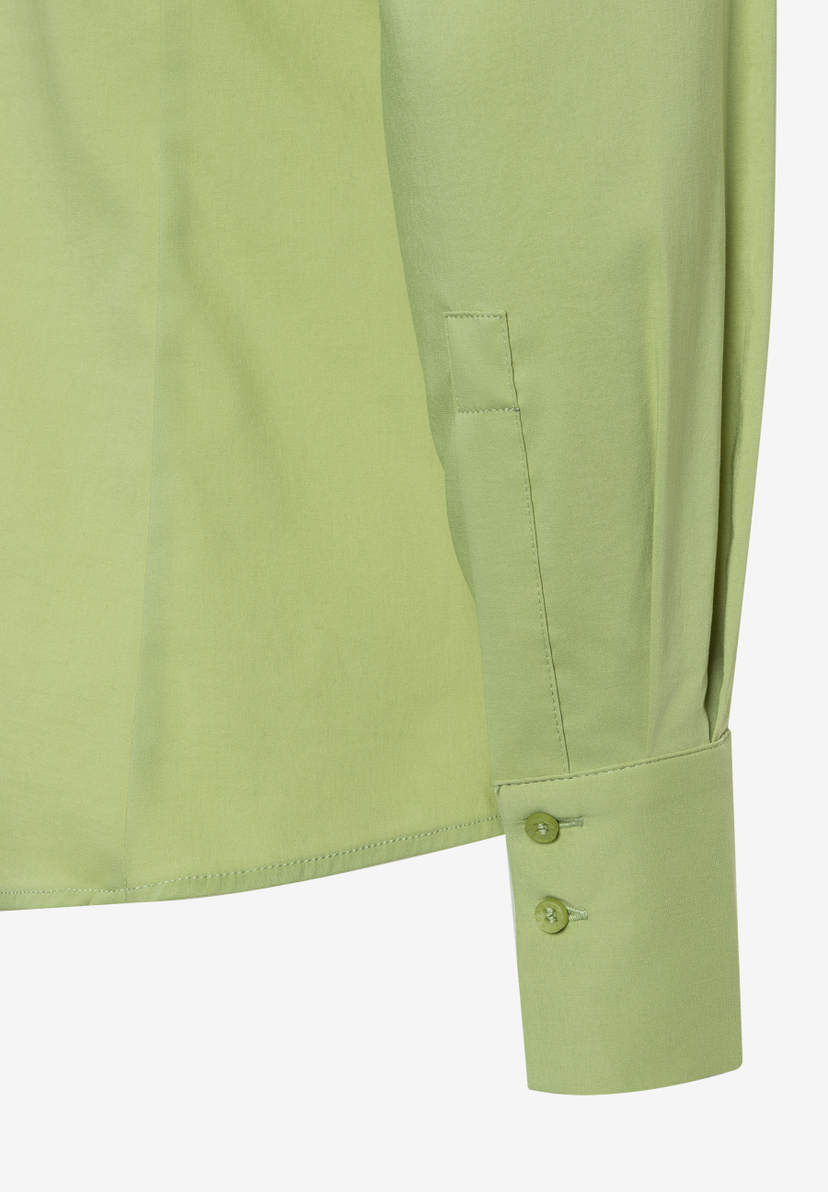 Detail einer MORE & MORE Bluse aus Popeline in frischem Grün mit Ärmelmanschette.