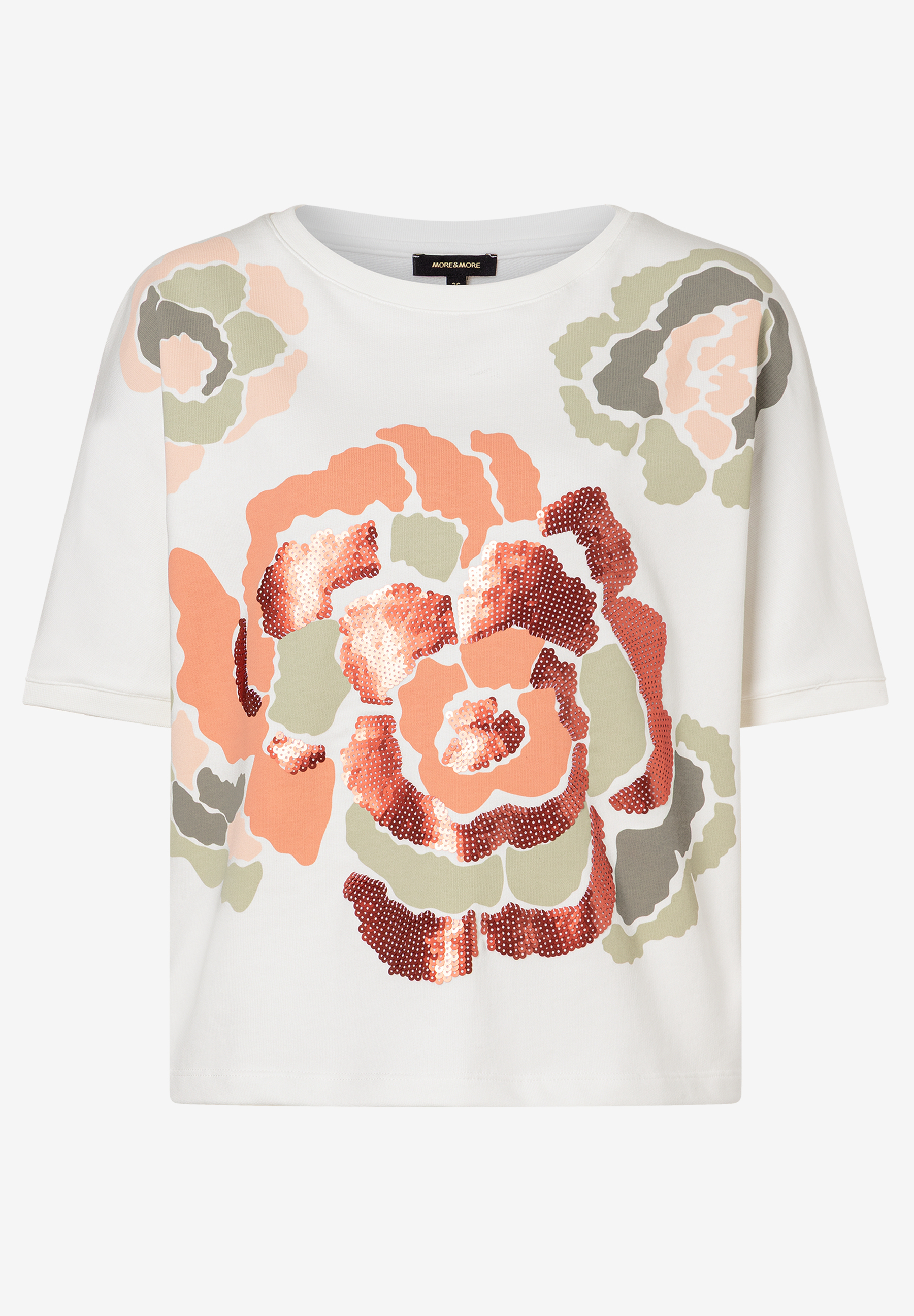 Ein weißes MORE & MORE Sweatshirt mit floralem Muster und glitzernden Pailletten. Ein weißes MORE & MORE Sweatshirt mit floralem Muster und glitzernden Pailletten.