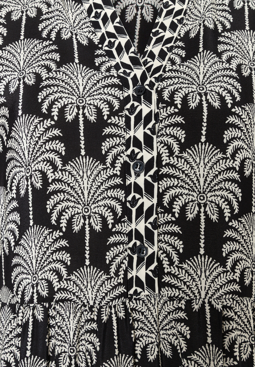 MORE & MORE Oberteil: Schwarzes Kleid mit weißem Palmenmuster und V-Ausschnitt mit Knopfleiste und geometrischem Muster. MORE & MORE Oberteil: Schwarzes Kleid mit weißem Palmenmuster und V-Ausschnitt mit Knopfleiste und geometrischem Muster.