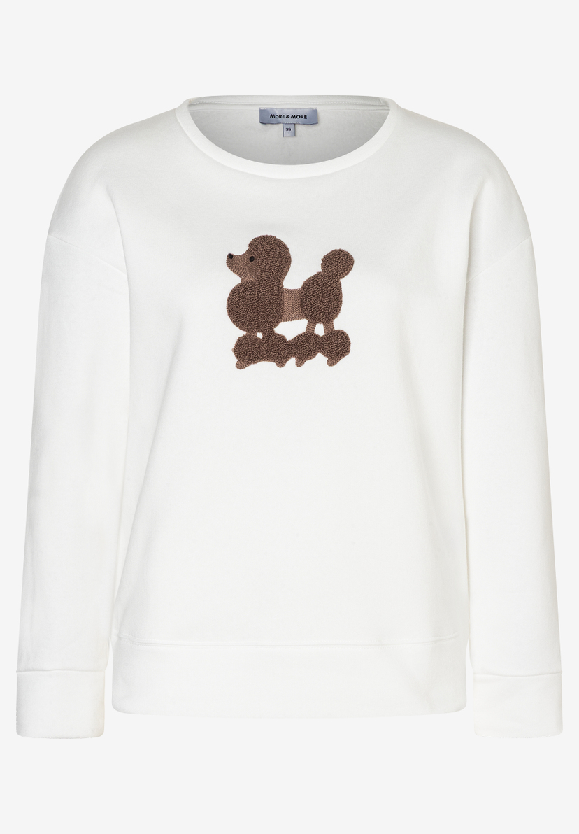 Ein weißes MORE & MORE Sweatshirt mit einem braunen Pudel-Motiv. Ein weißes MORE & MORE Sweatshirt mit einem braunen Pudel-Motiv.