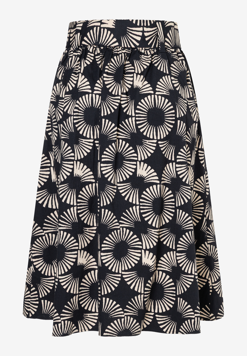 Ein MORE & MORE Rock mit schwarzem Grund und hellen, strahlenförmigen Mustern. Ein MORE & MORE Rock mit schwarzem Grund und hellen, strahlenförmigen Mustern.