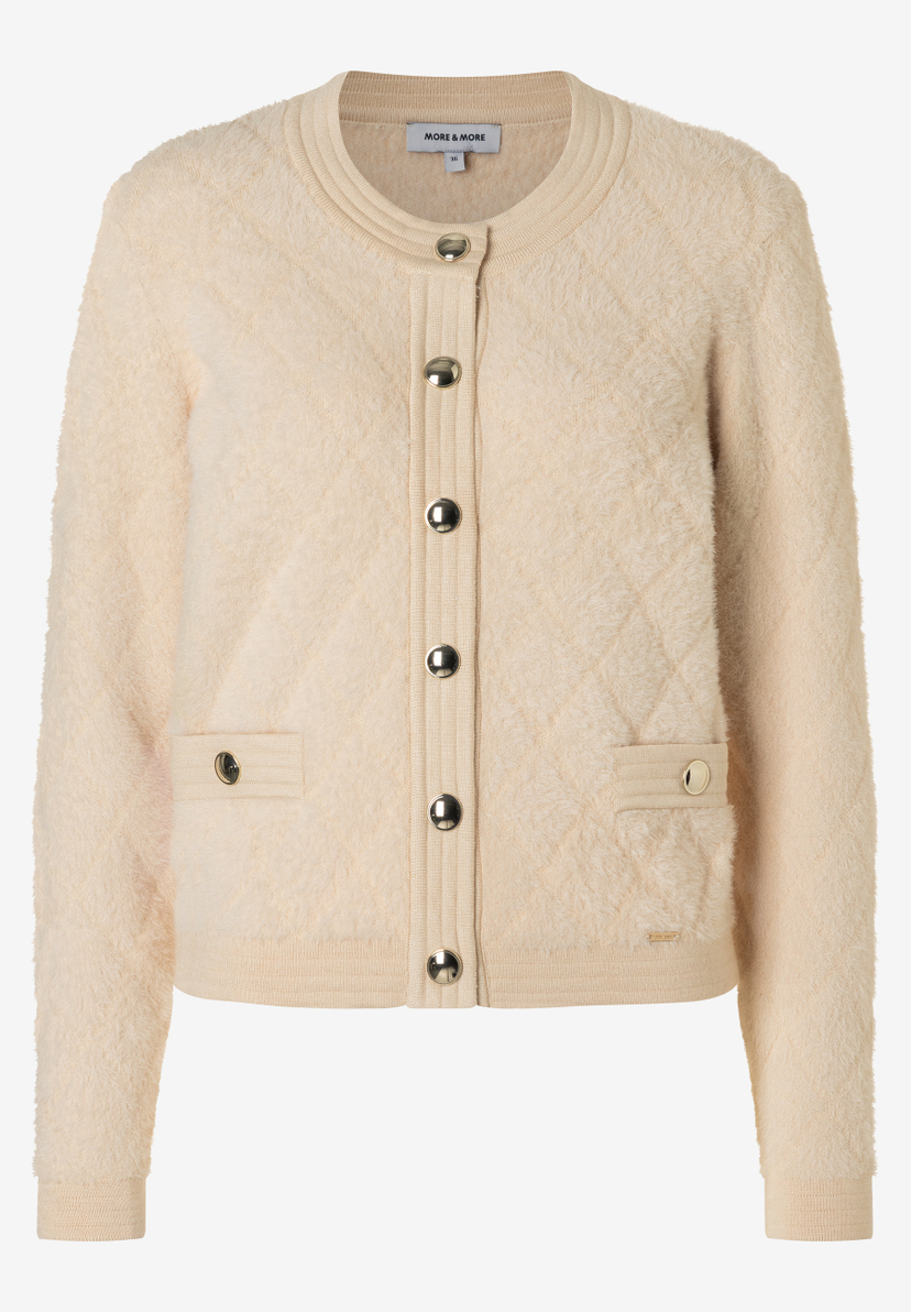 Eine MORE & MORE Strickjacke in Creme mit Kunstfell, Knopfleiste und Taschen. Eine MORE & MORE Strickjacke in Creme mit Kunstfell, Knopfleiste und Taschen.