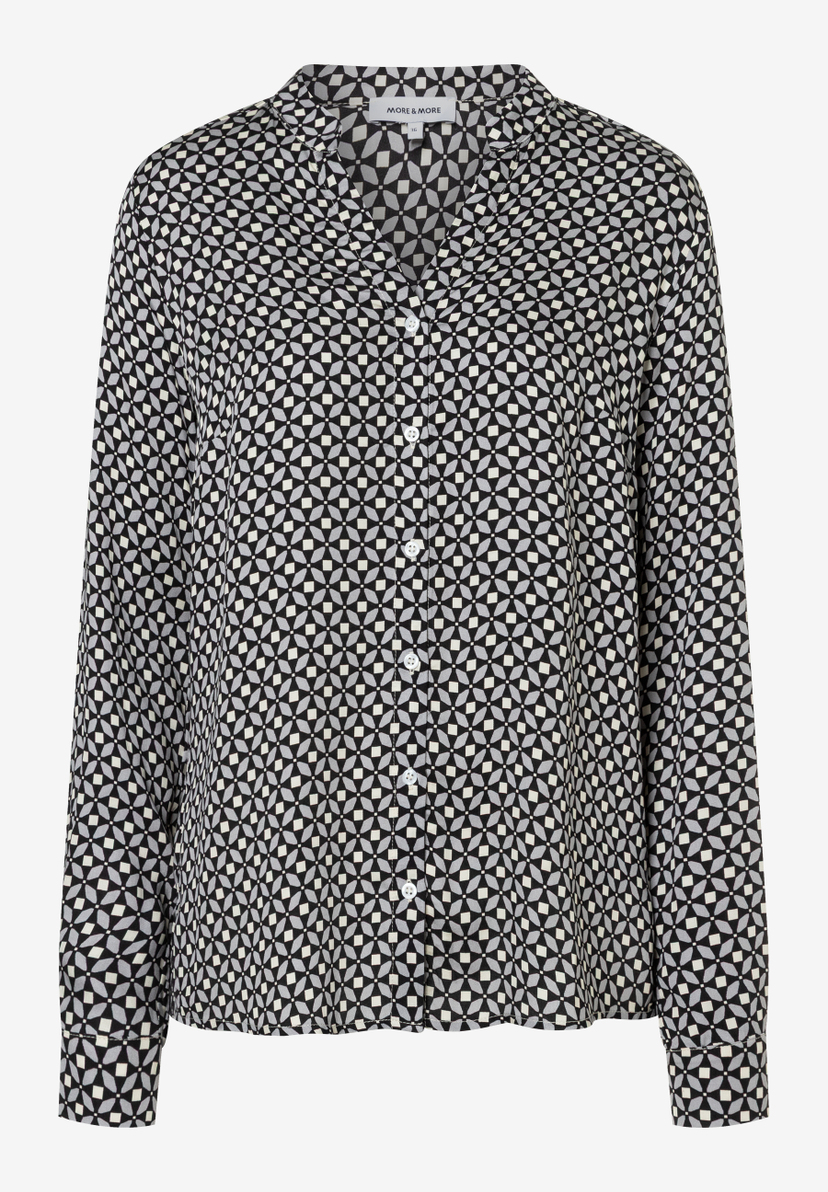 Eine langärmelige MORE & MORE Bluse mit grafischem Muster in Schwarz, Weiß und Grau. Eine langärmelige MORE & MORE Bluse mit grafischem Muster in Schwarz, Weiß und Grau.