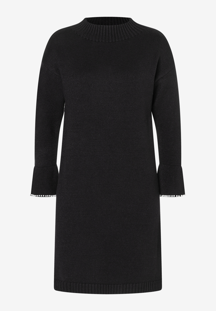 Ein schwarzes, gestricktes MORE & MORE Oberteil, ein Kleid mit langen Ärmeln und Perlen an den Ärmelenden. Ein schwarzes, gestricktes MORE & MORE Oberteil, ein Kleid mit langen Ärmeln und Perlen an den Ärmelenden.