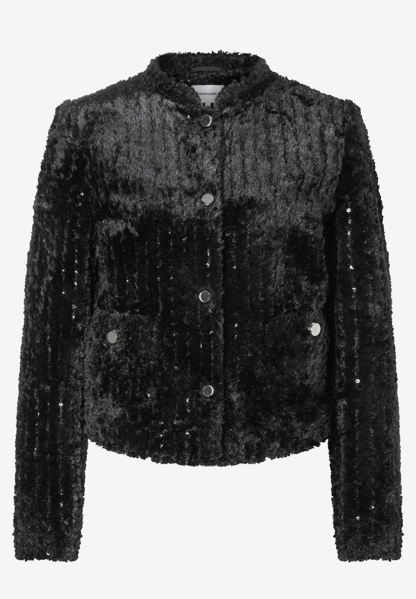 Ein schwarzer MORE & MORE Blazer mit silbernen Knöpfen und leichtem Glitzer. Ein schwarzer MORE & MORE Blazer mit silbernen Knöpfen und leichtem Glitzer.