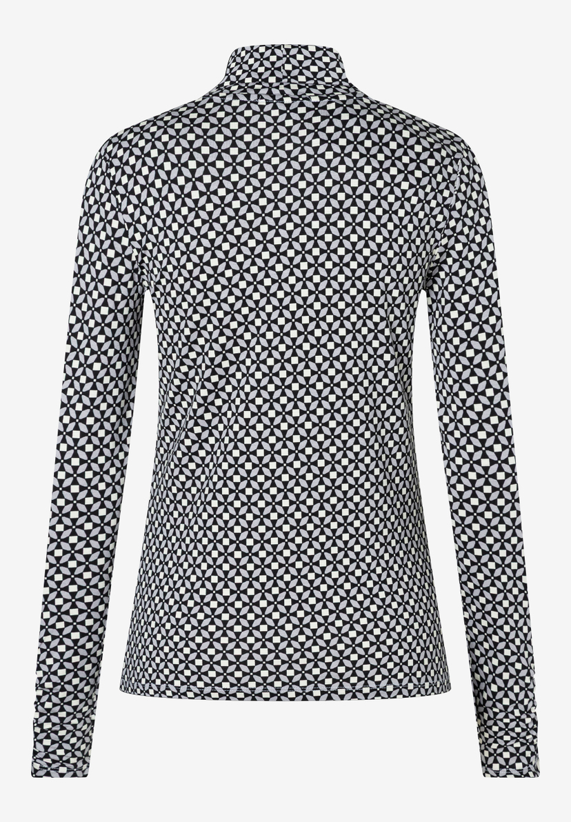 Ein langärmeliges MORE & MORE Oberteil mit geometrischem Muster. Ein langärmeliges MORE & MORE Oberteil mit geometrischem Muster.