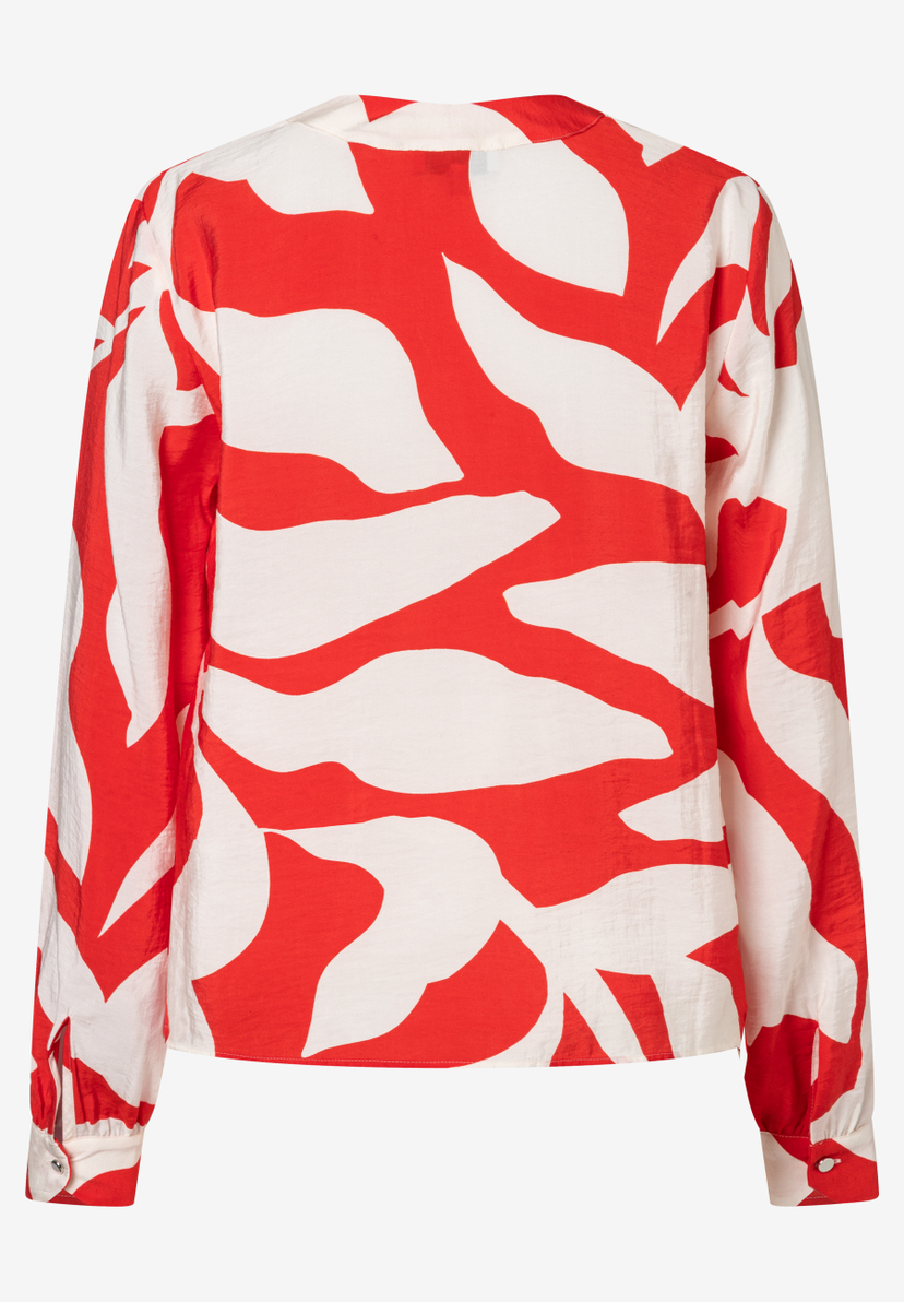 Die MORE & MORE Bluse ist weiß und rot gemustert, mit langen Ärmeln und Webware. Die MORE & MORE Bluse ist weiß und rot gemustert, mit langen Ärmeln und Webware.