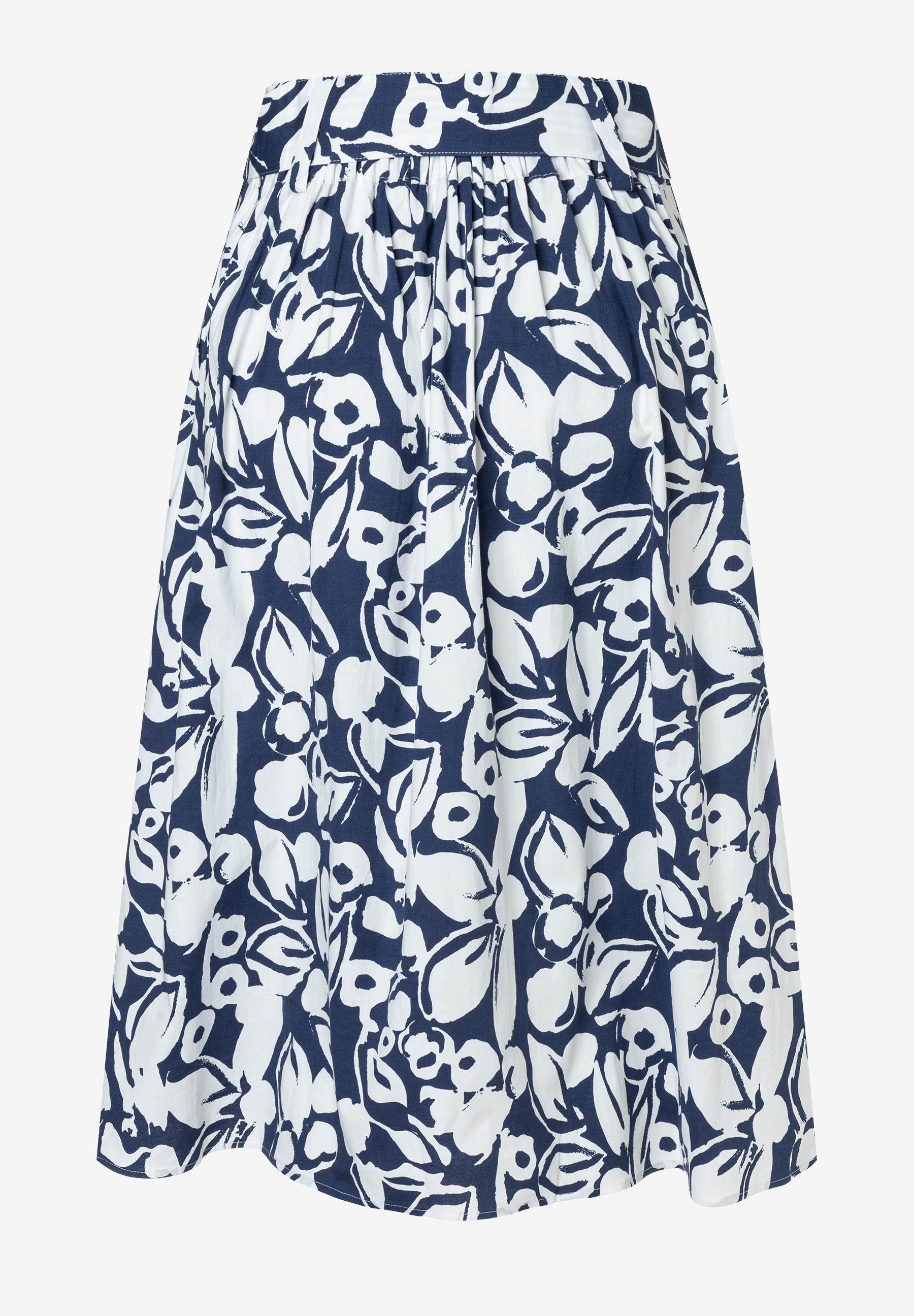 Ein ausgestellter Rock von MORE & MORE mit blau-weißem Blumenmuster vor einem hellen Hintergrund. Ein ausgestellter Rock von MORE & MORE mit blau-weißem Blumenmuster vor einem hellen Hintergrund.