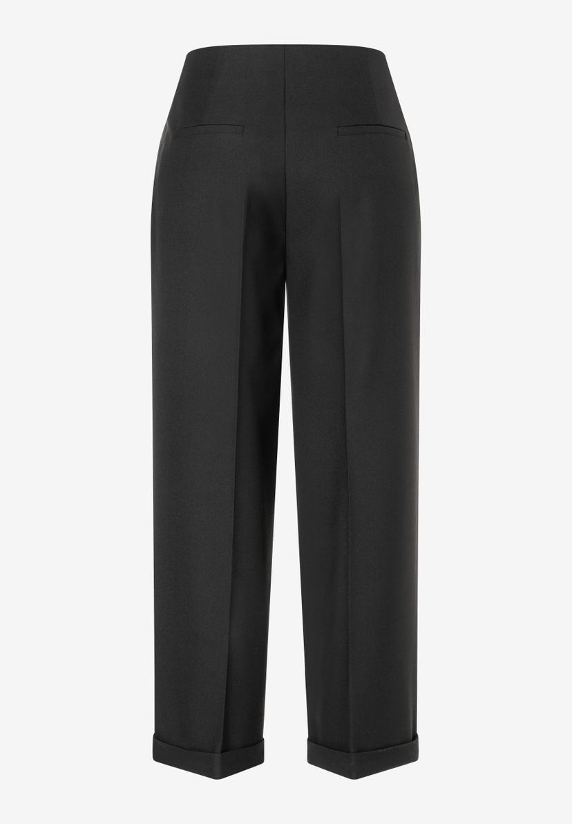 Schwarze Webhose von MORE & MORE mit hohem Bund, geradem Bein und Umschlag am Saum. Schwarze Webhose von MORE & MORE mit hohem Bund, geradem Bein und Umschlag am Saum.