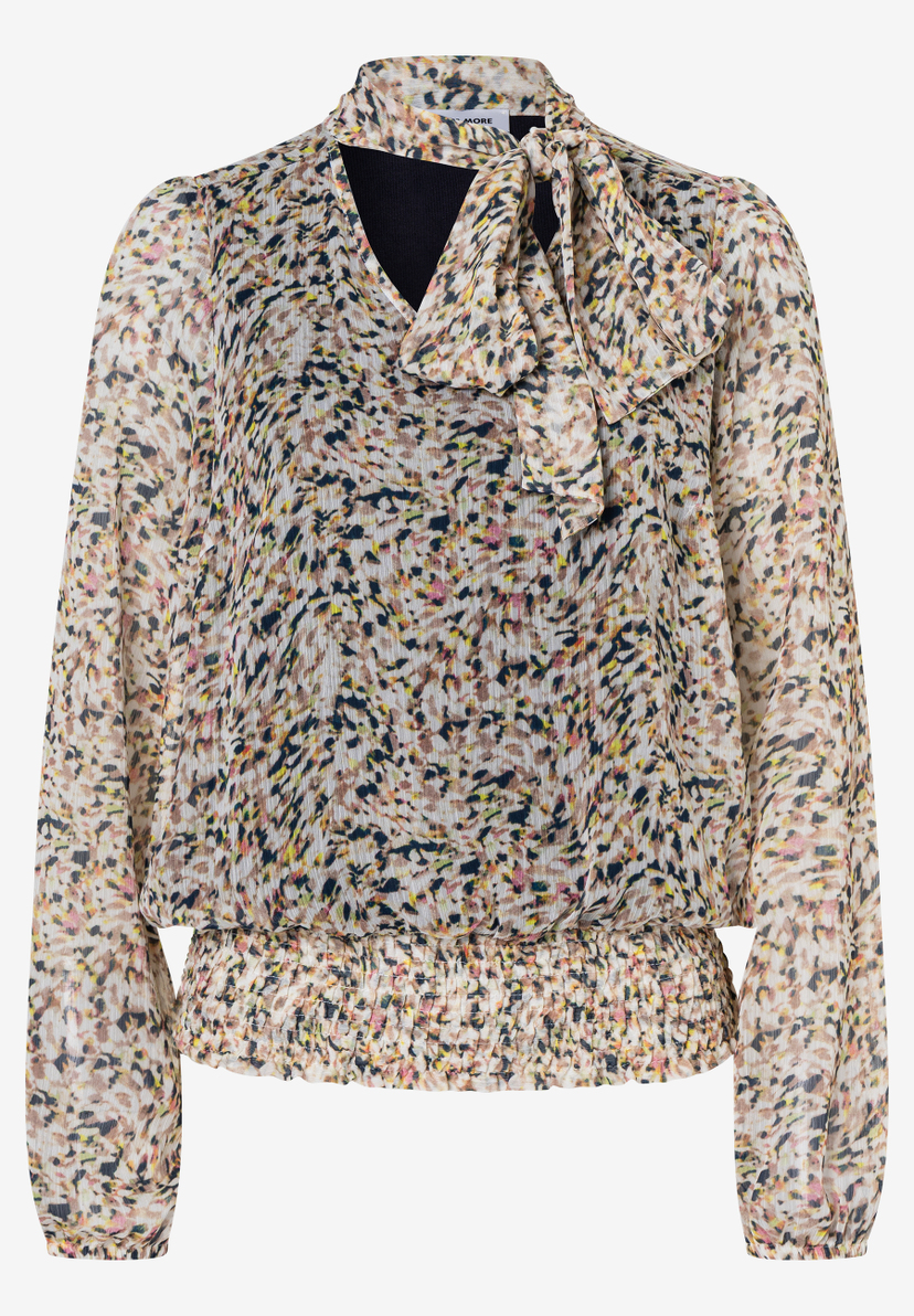 Eine MORE & MORE Bluse mit buntem Muster und langen Ärmeln. Sie hat einen Bindeband am Kragen und einen Gummizug an der Taille. Eine MORE & MORE Bluse mit buntem Muster und langen Ärmeln. Sie hat einen Bindeband am Kragen und einen Gummizug an der Taille.